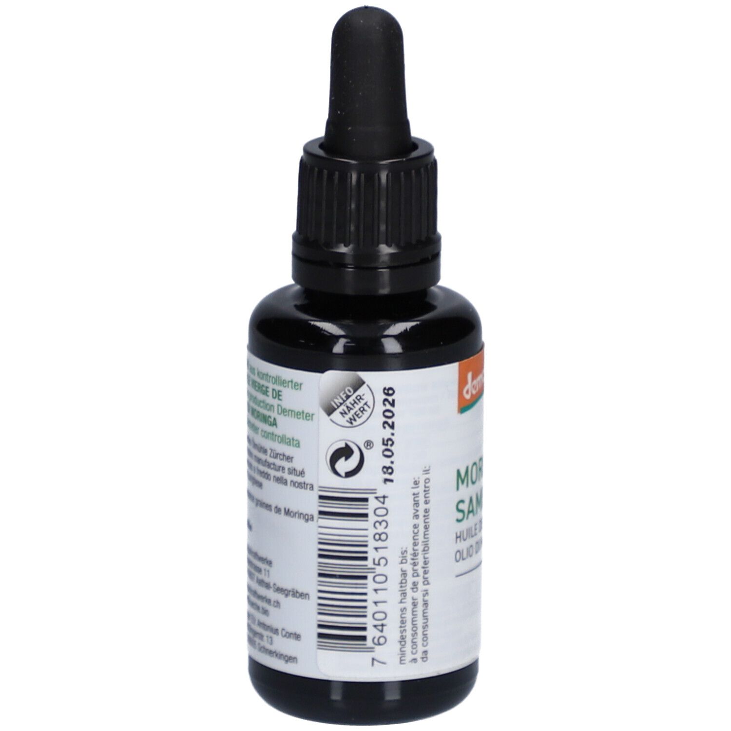 Rückseite der braunen Glasflasche mit schwarzem Tropfer. Barcode, Mindesthaltbarkeitsdatum, Informationen.