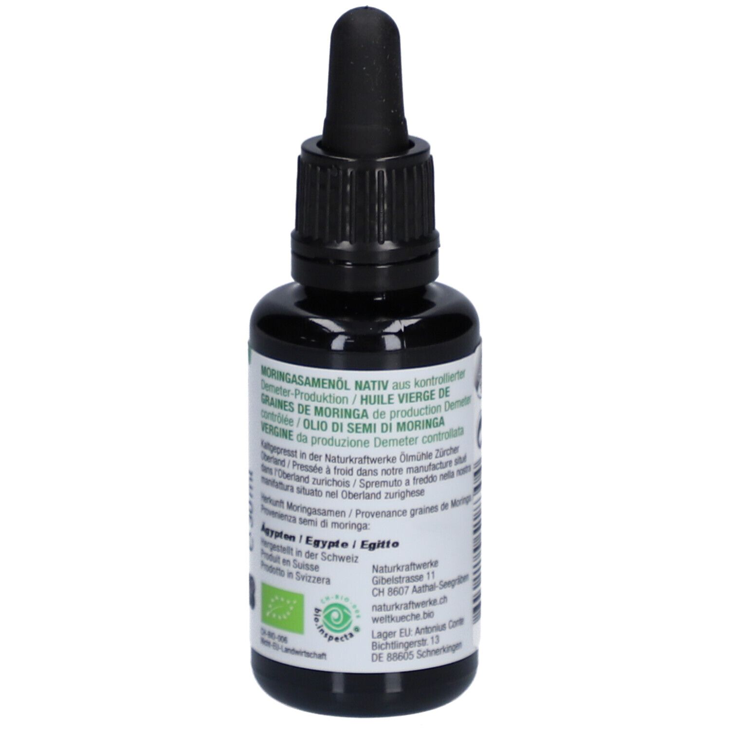 Braune Glasflasche mit schwarzem Tropfer. Aufschrift: Moringa Samenöl nativ, Demeter-Zertifizierung, Bio-Siegel.