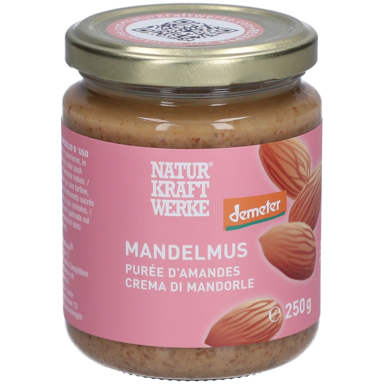 Glas mit Mandelmus. Rosa Etikett mit "NATURKRAFTWERKE", "MANDELMUS", "Demeter"-Logo und Mandeln. Deckel mit QR-Code.