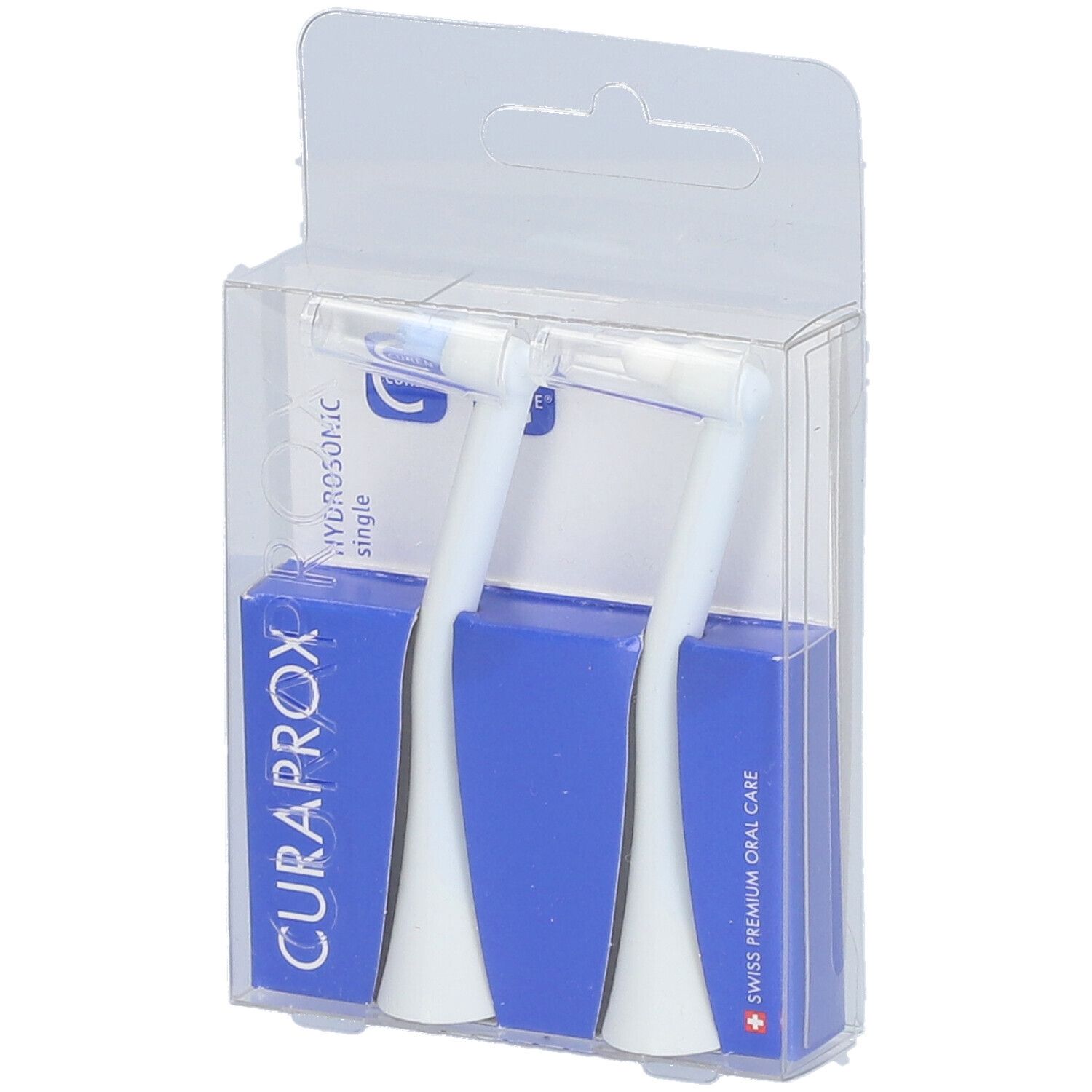 Zwei weiße Bürstenköpfe in einer transparenten Verpackung. Blaue Kartons mit CURAPROX-Logo.