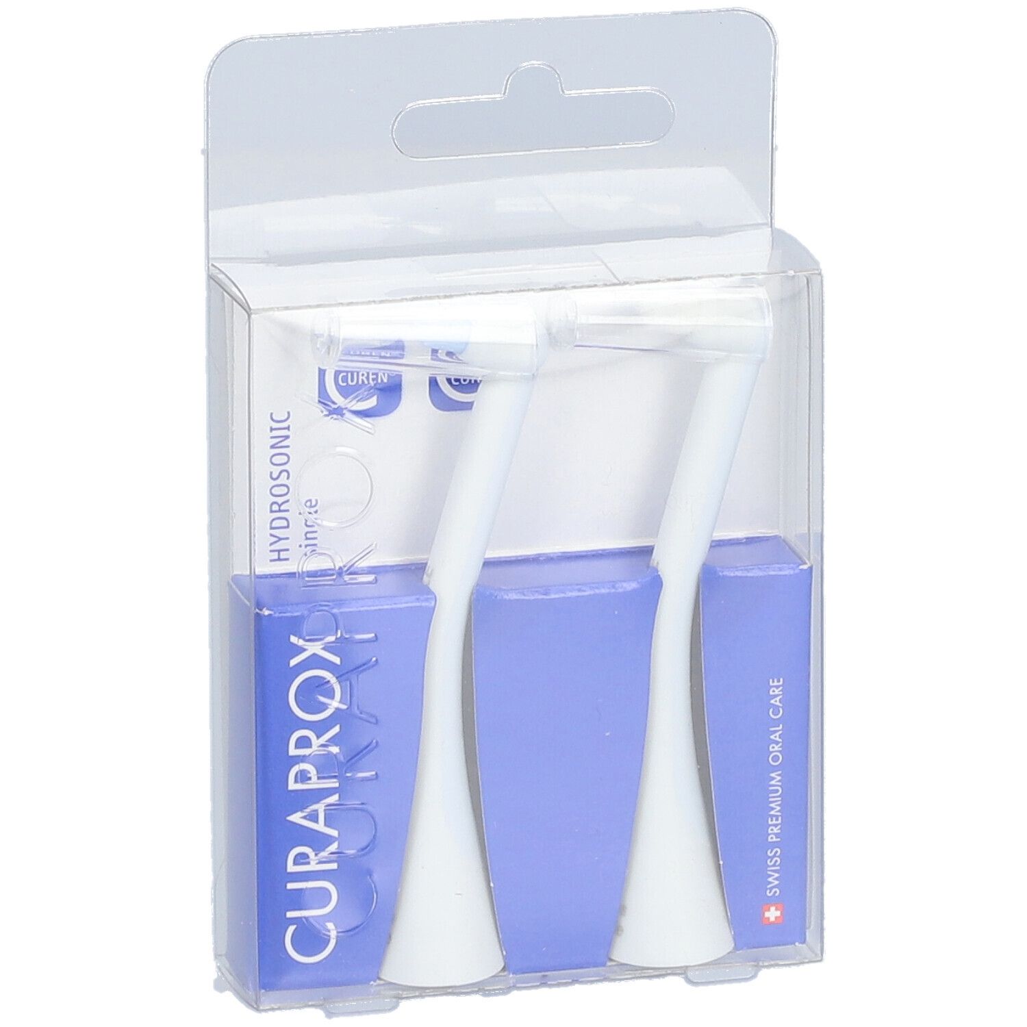 Zwei weiße Bürstenköpfe in transparenter Verpackung. Blaue Kartons mit CURAPROX-Logo und Text.