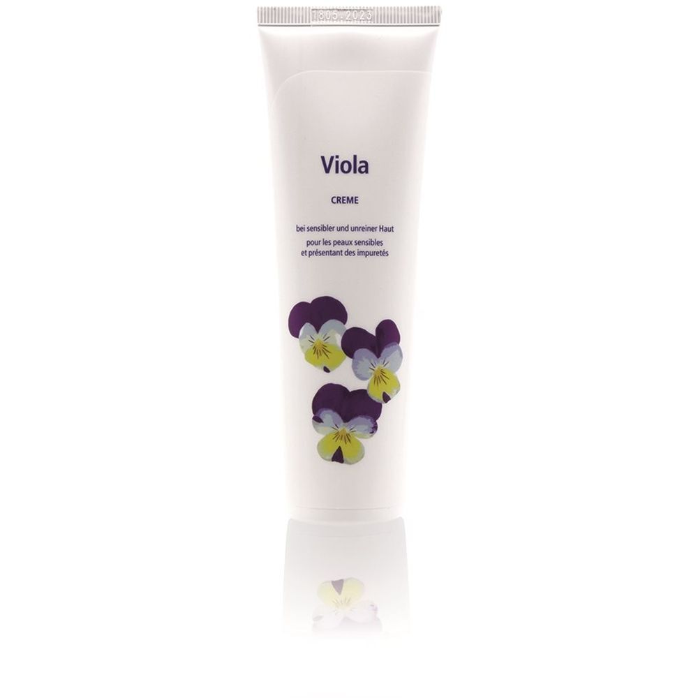 Tube blanc avec fleurs violettes et texte "Viola Creme". Texte en allemand et français. Surface réfléchissante.