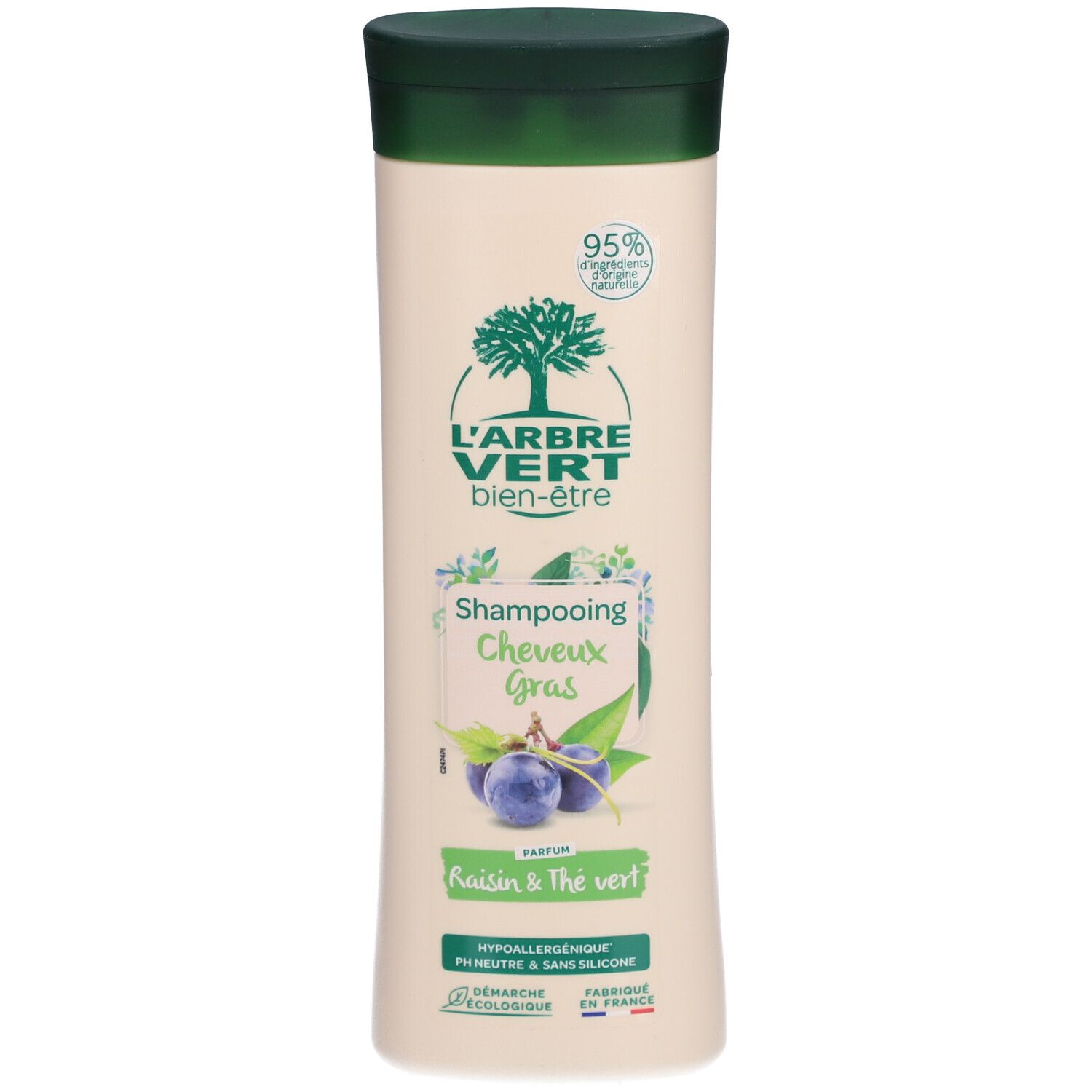 Flacon de shampooing beige, bouchon vert. Inscription: L'ARBRE VERT bien-être, Shampooing Cheveux Gras, Raisin & Thé vert. Label écologique.