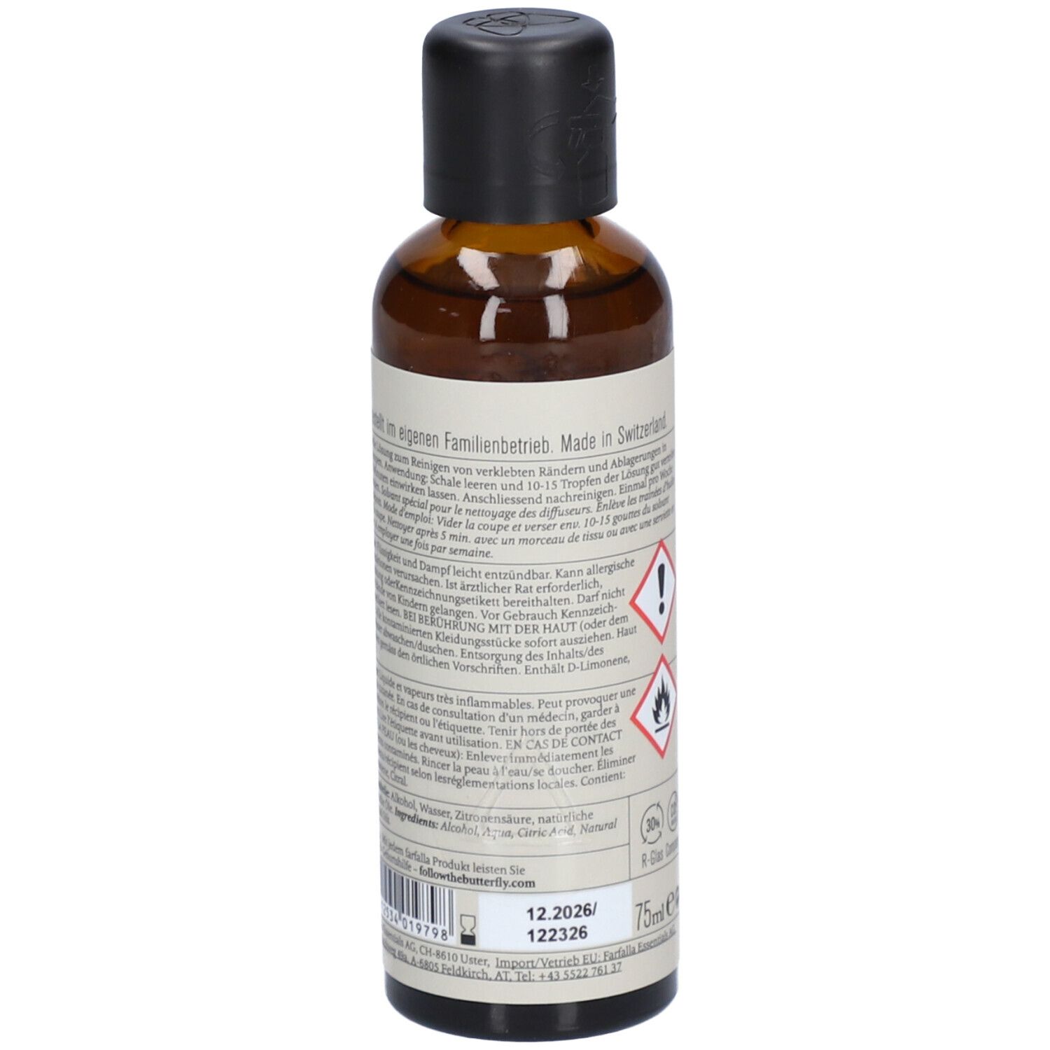 Braune Glasflasche, Rückansicht. Etikett mit Text und Warnhinweisen. Hergestellt in der Schweiz. 75ml.