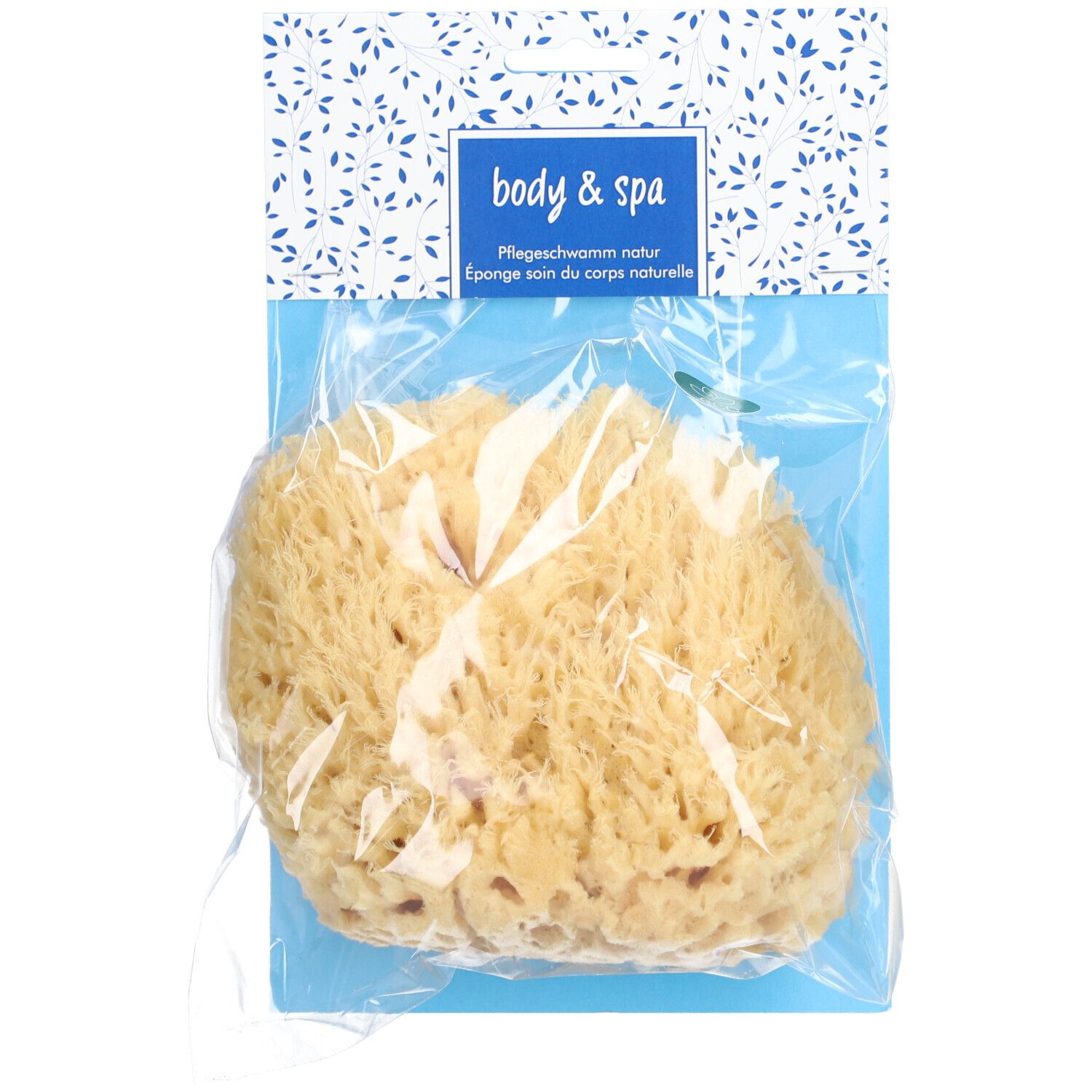 Natuurspons in plastic verpakking. Opschrift: body & spa, Pflegeschwamm natur, Eponge soin du corps naturelle.