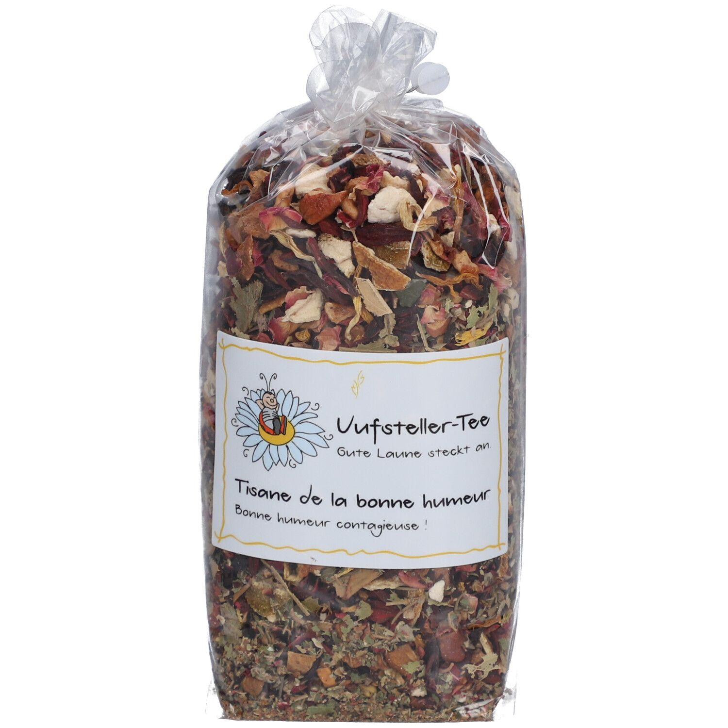 Teebeutel mit Kräutermischung in transparenter Verpackung. Aufkleber mit Text: Uufsteller-Tee, Tisane de la bonne humeur.