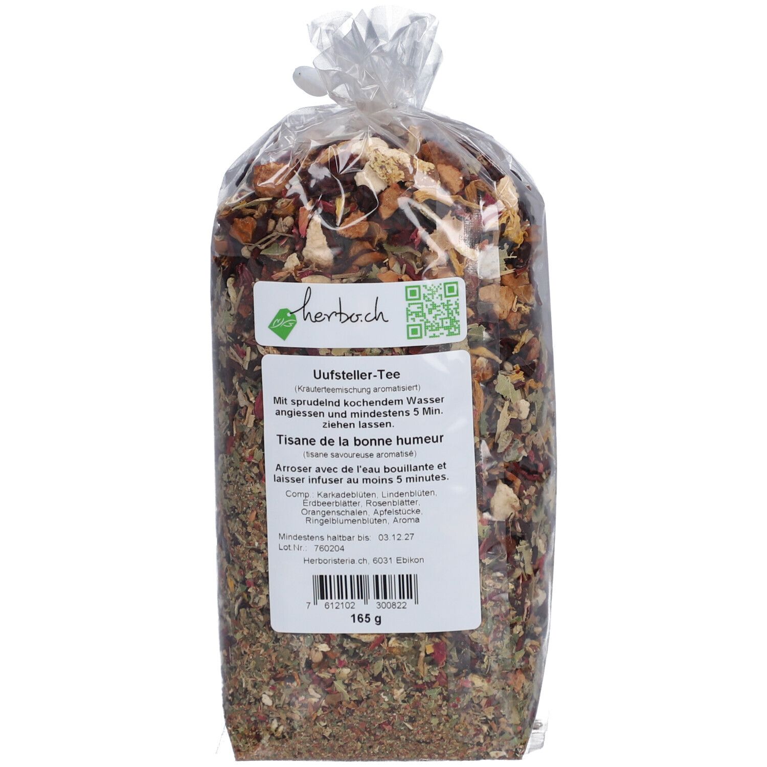 Transparenter Teebeutel mit Kräutermischung. Etikett mit Text und QR-Code. Text: Uufsteller-Tee, Tisane de la bonne humeur. Gewicht: 165 g.