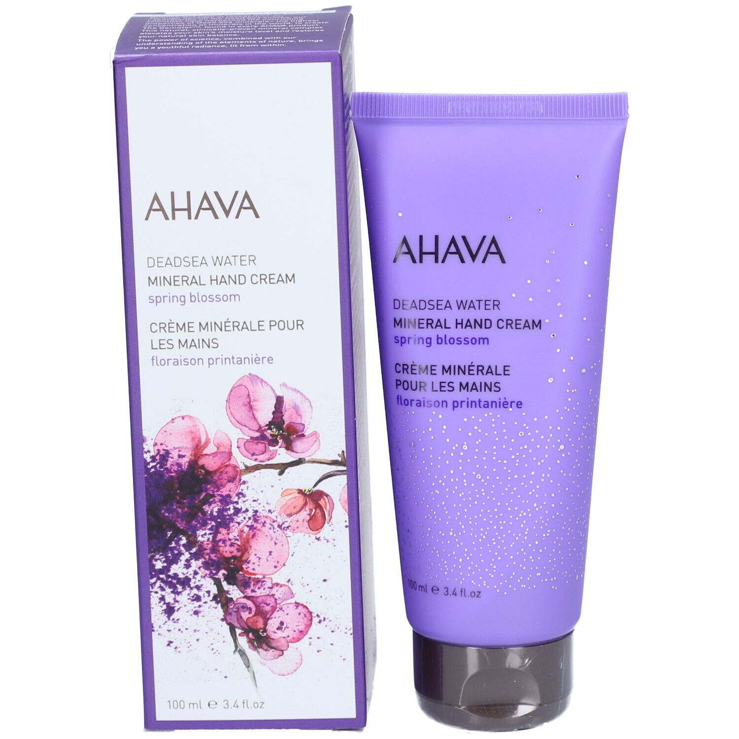 Produktverpackung: Tube und Schachtel. AHAVA Mineral Hand Cream Spring Blossom. Lila und weiß.