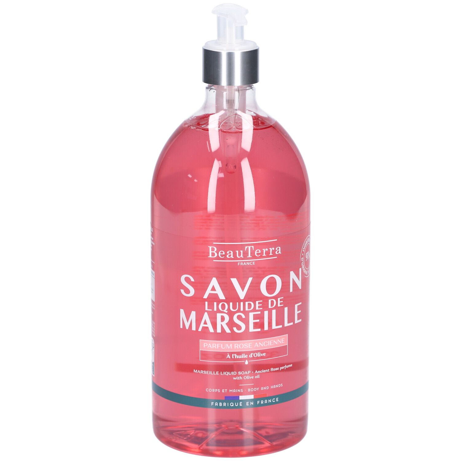 Transparente Flasche mit rosafarbenem Inhalt. Aufschrift: Savon Liquide de Marseille. Mit Spender.