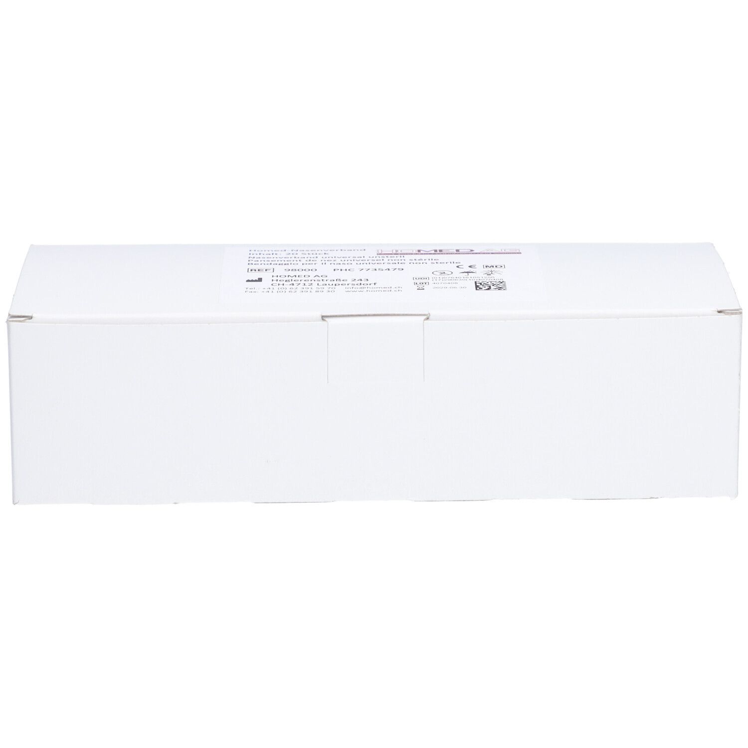 Emballage rectangulaire blanc avec inscriptions. Nom du produit non visible.