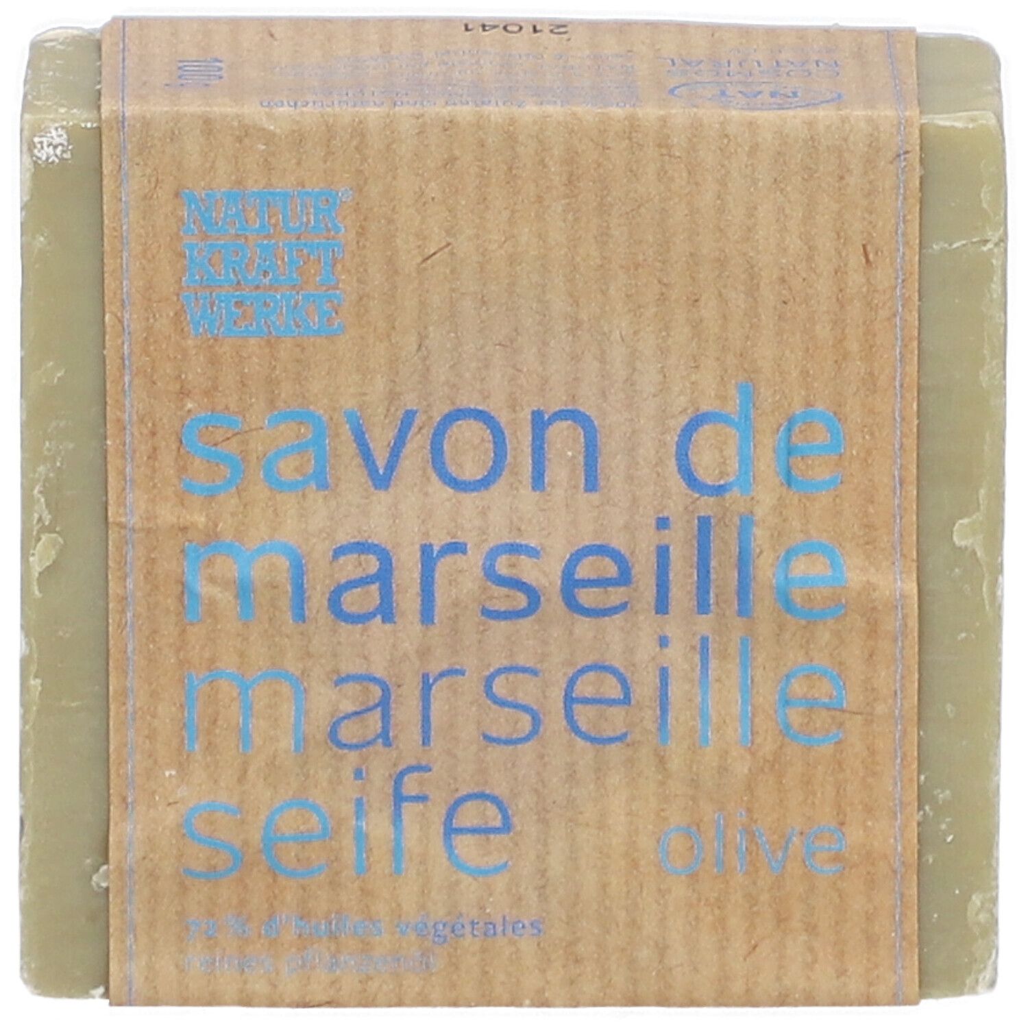 Seife mit Papierbanderole. Aufschrift: Savon de Marseille, Marseille Seife, Olive. Marke Naturkraftwerke.