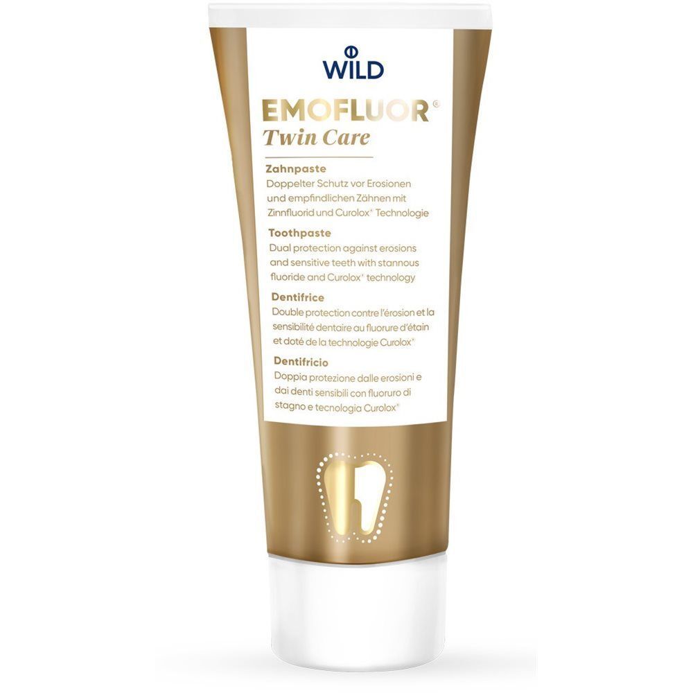 Zahnpasta EMOFLUOR® Twin Care in Tube. Goldfarben, mit Schriftzug und Zahn-Symbol. Doppelter Schutz.