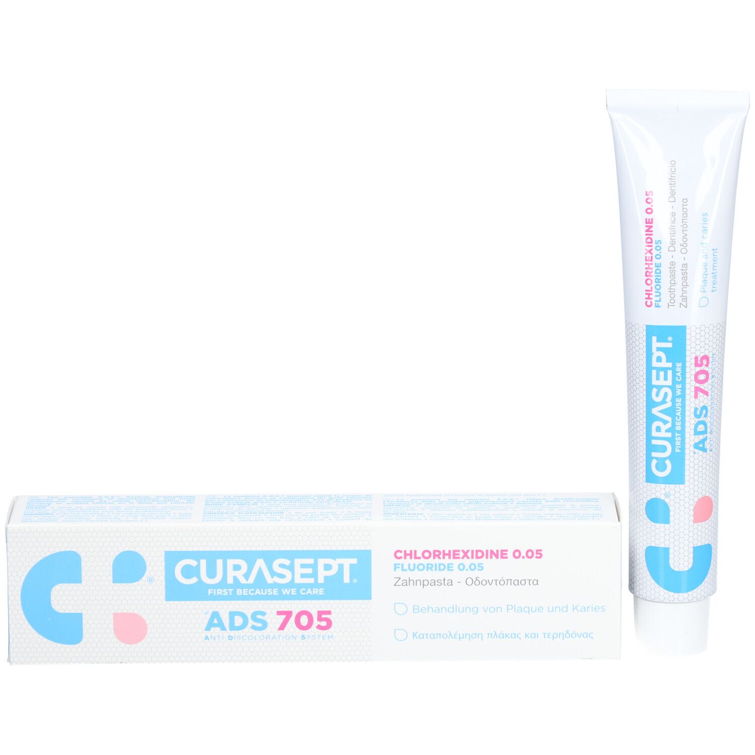 Zahncreme-Tube und Schachtel. Tube weiß mit blauer und rosa Schrift. Schachtel weiß mit blauer und rosa Schrift.