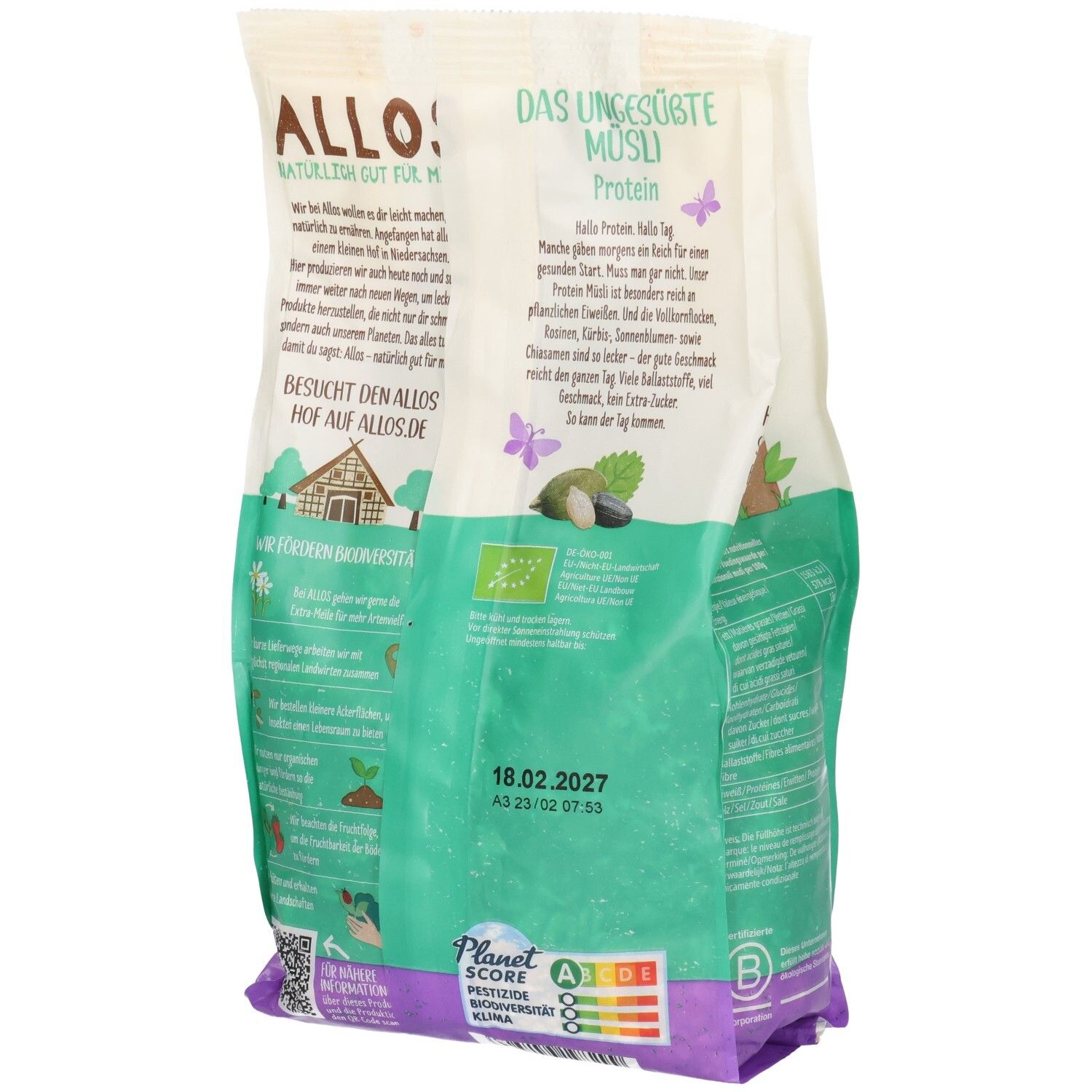 Rückseite der Verpackung von ALLOS Bio Protein Müsli ungesüßt. Grün-weiße Tüte mit Produktinformationen und Logo. Enthält Bio-Siegel und Mindesthaltbarkeitsdatum.