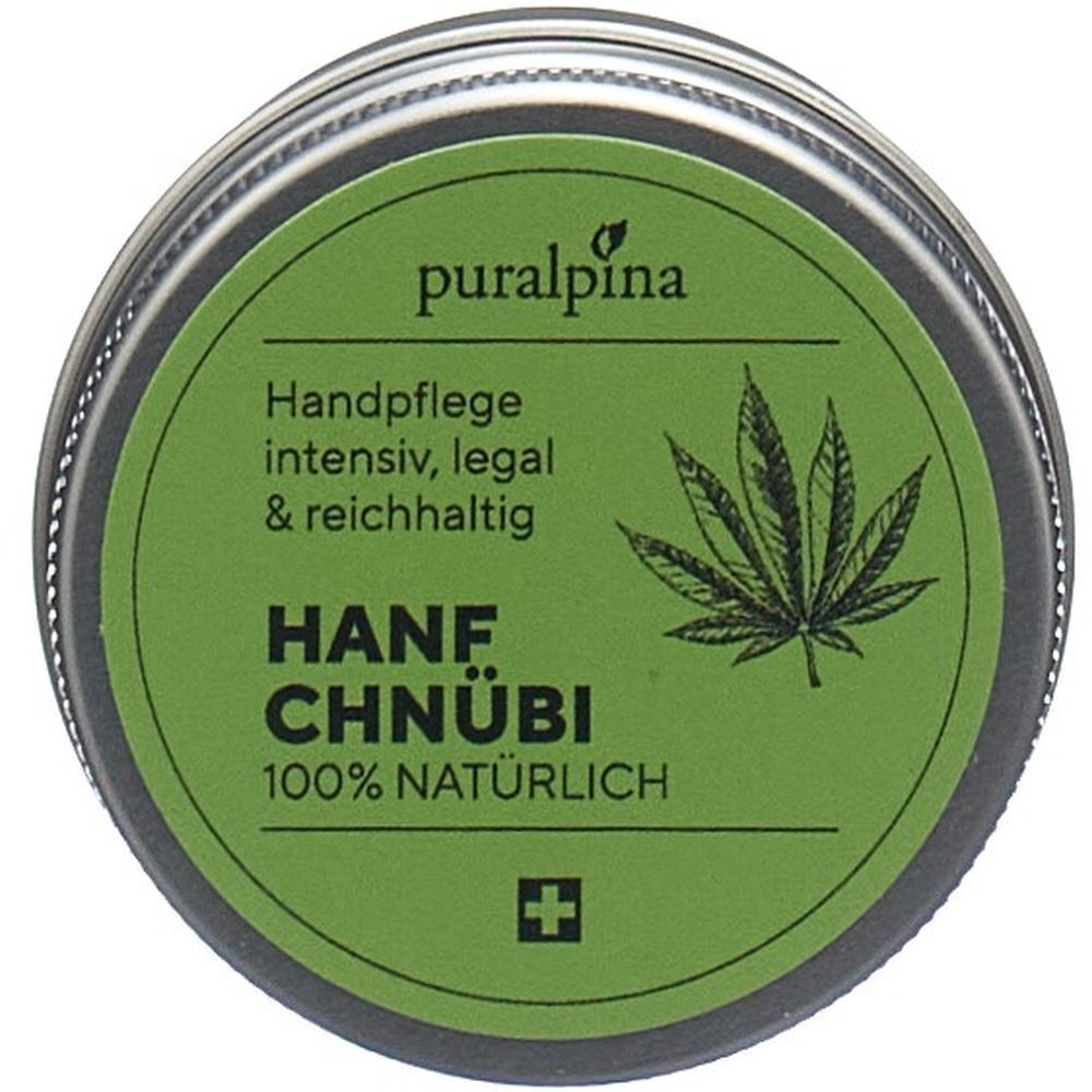 Runde Dose mit grünem Etikett. Aufschrift: PURALPINA, Hanf Chnübi, Hanfblatt-Illustration, Schweizer Kreuz. Text: Handpflege intensiv, legal & reichhaltig.