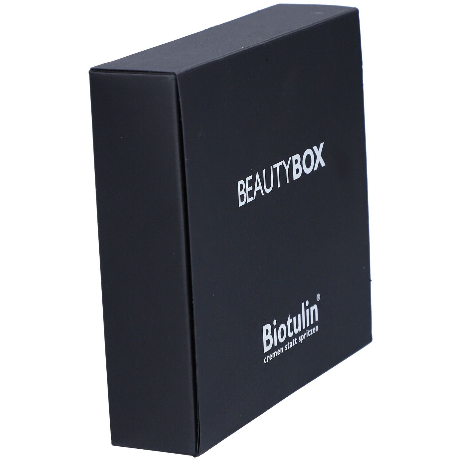 Schwarze Beautybox, schräg von der Seite. Aufschrift BEAUTYBOX und BIOTULIN Logo. Text: cremen statt spritzen.