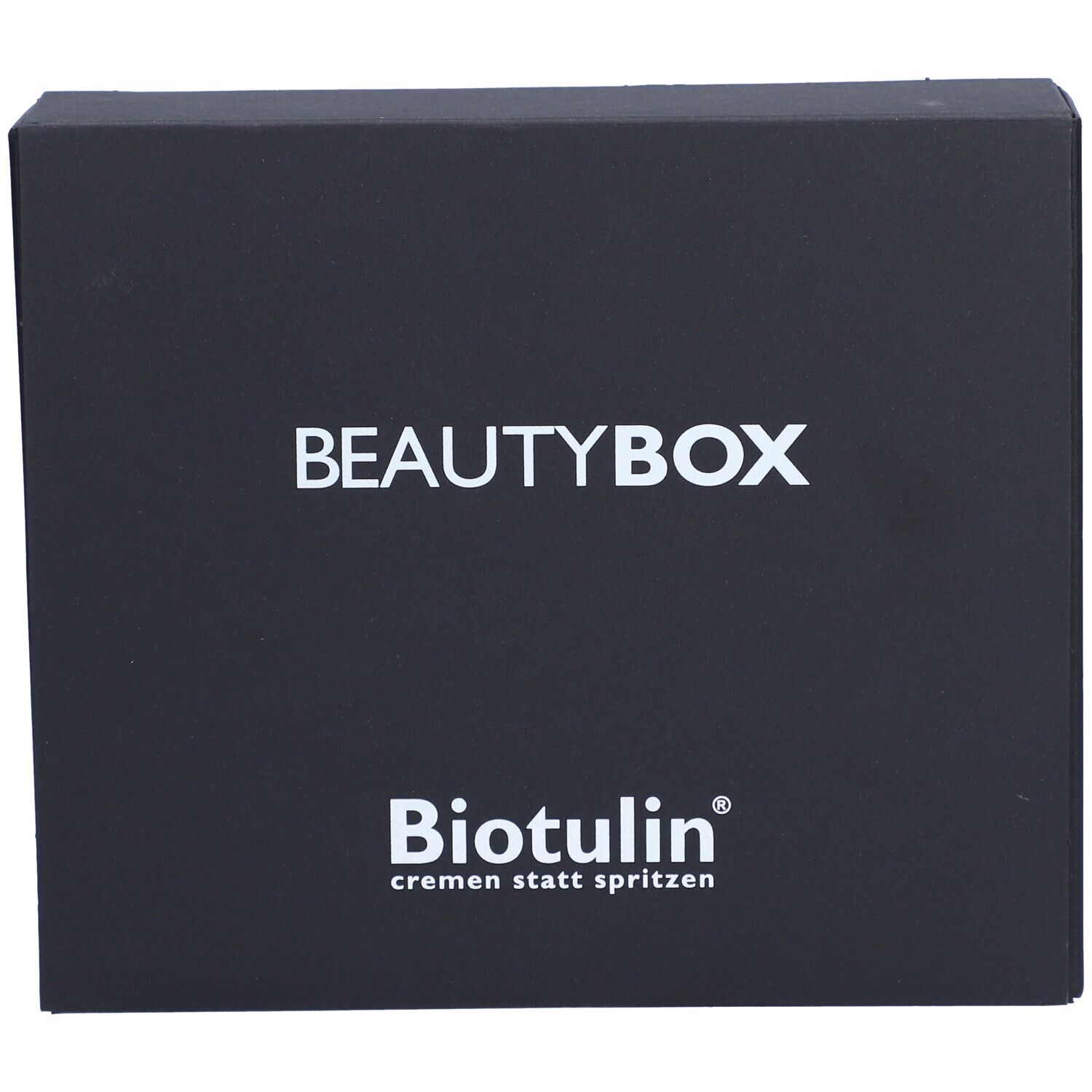 Schwarze Beautybox mit weißem Schriftzug BEAUTYBOX und BIOTULIN Logo. Text: cremen statt spritzen.