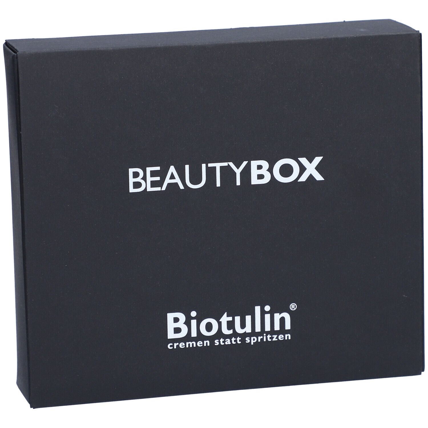 Schwarze Beautybox mit weißem Schriftzug BEAUTYBOX und BIOTULIN Logo. Text: cremen statt spritzen.