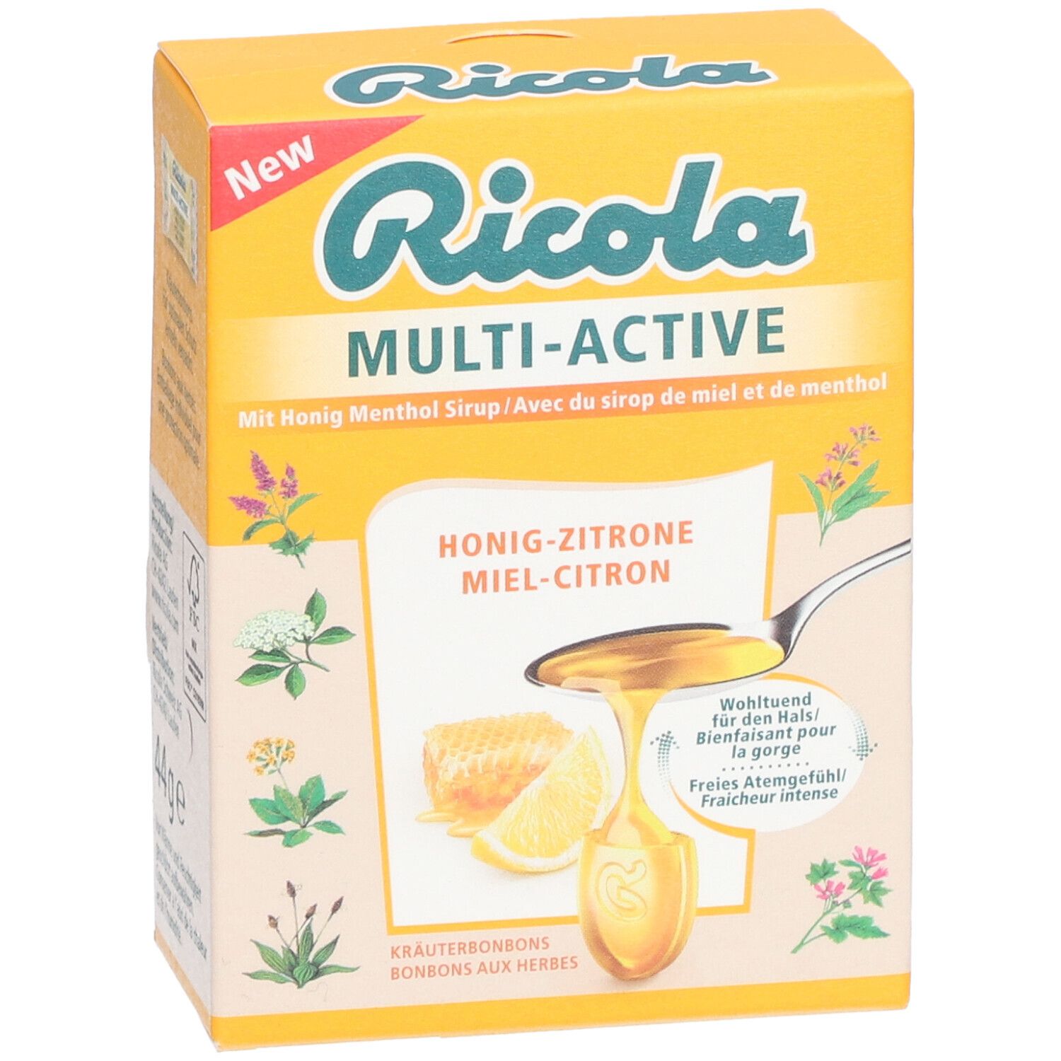 Gelbe Schachtel Ricola Multi-Active Honig-Zitrone. Aufschrift "New". Illustrationen von Kräutern und Honig.