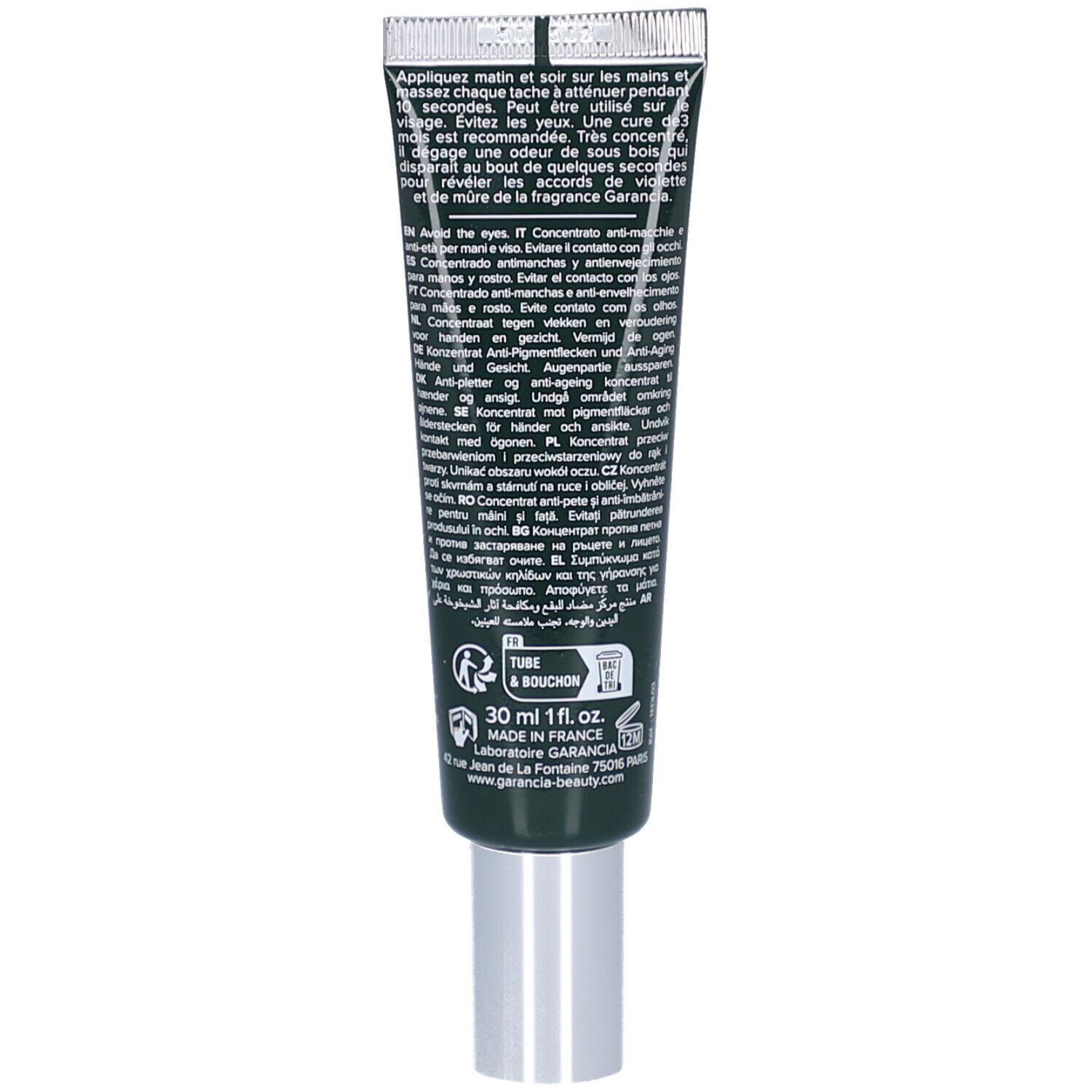 Rückseite der Creme-Tube. Text in mehreren Sprachen. Schwarzer Hintergrund mit grünen Elementen.