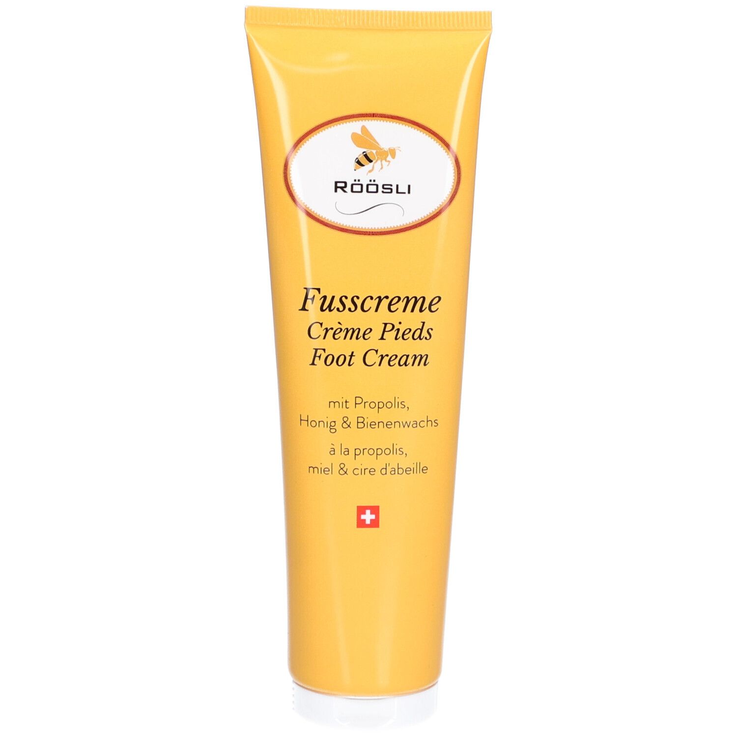 Gelbe Tube RÖÖSLI Fusscreme. Logo mit Biene. Text: Fusscreme, Crème Pieds, Foot Cream. Schweizer Kreuz.