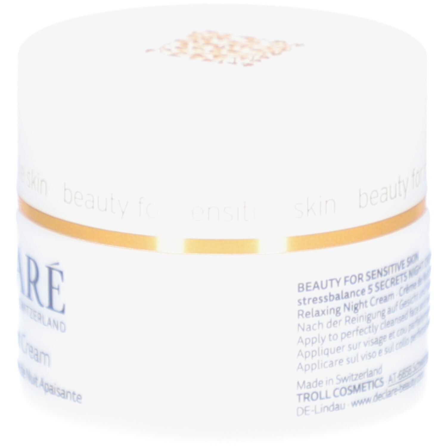 Weißer Tiegel mit goldfarbenem Deckel. Aufschrift: DECLARÉ, 5 Secrets Night Cream. Text auf der Seite.