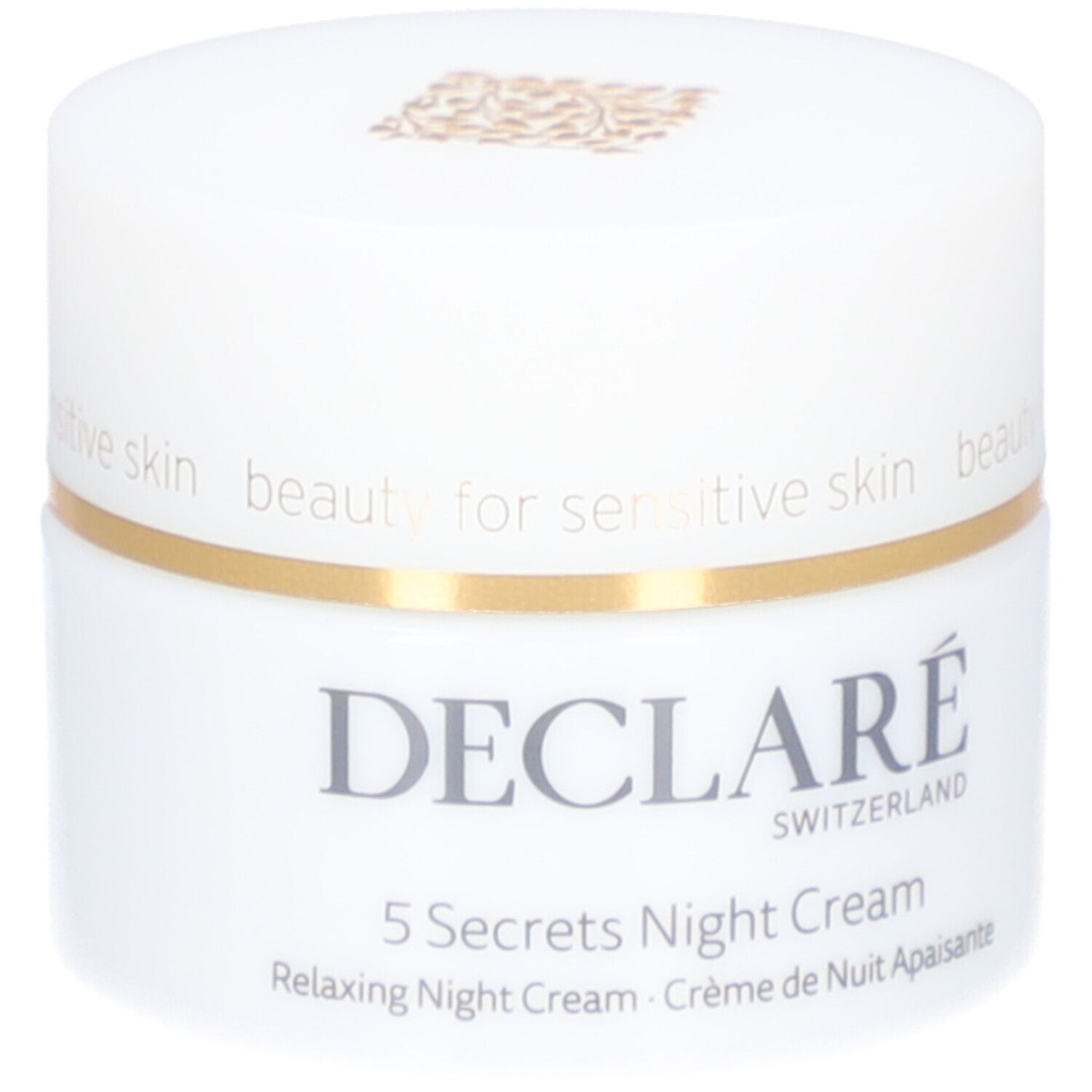 Weißer Tiegel mit goldfarbenem Deckel. Aufschrift: DECLARÉ, 5 Secrets Night Cream. Text: Relaxing Night Cream, Crème de Nuit Apaisante.