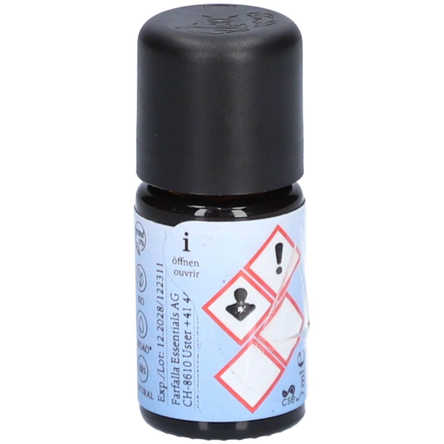Petite bouteille en verre avec bouchon noir. Étiquette avec symboles de danger, texte "Öffnen" et informations fabricant.