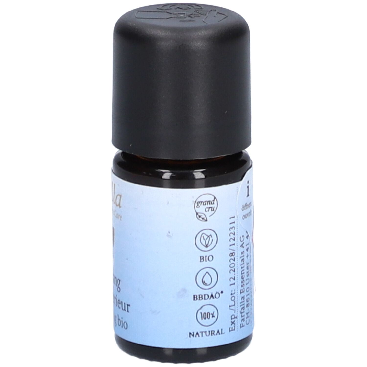 Petite bouteille en verre avec bouchon noir. Étiquette avec logos de qualité bio et produit naturel.