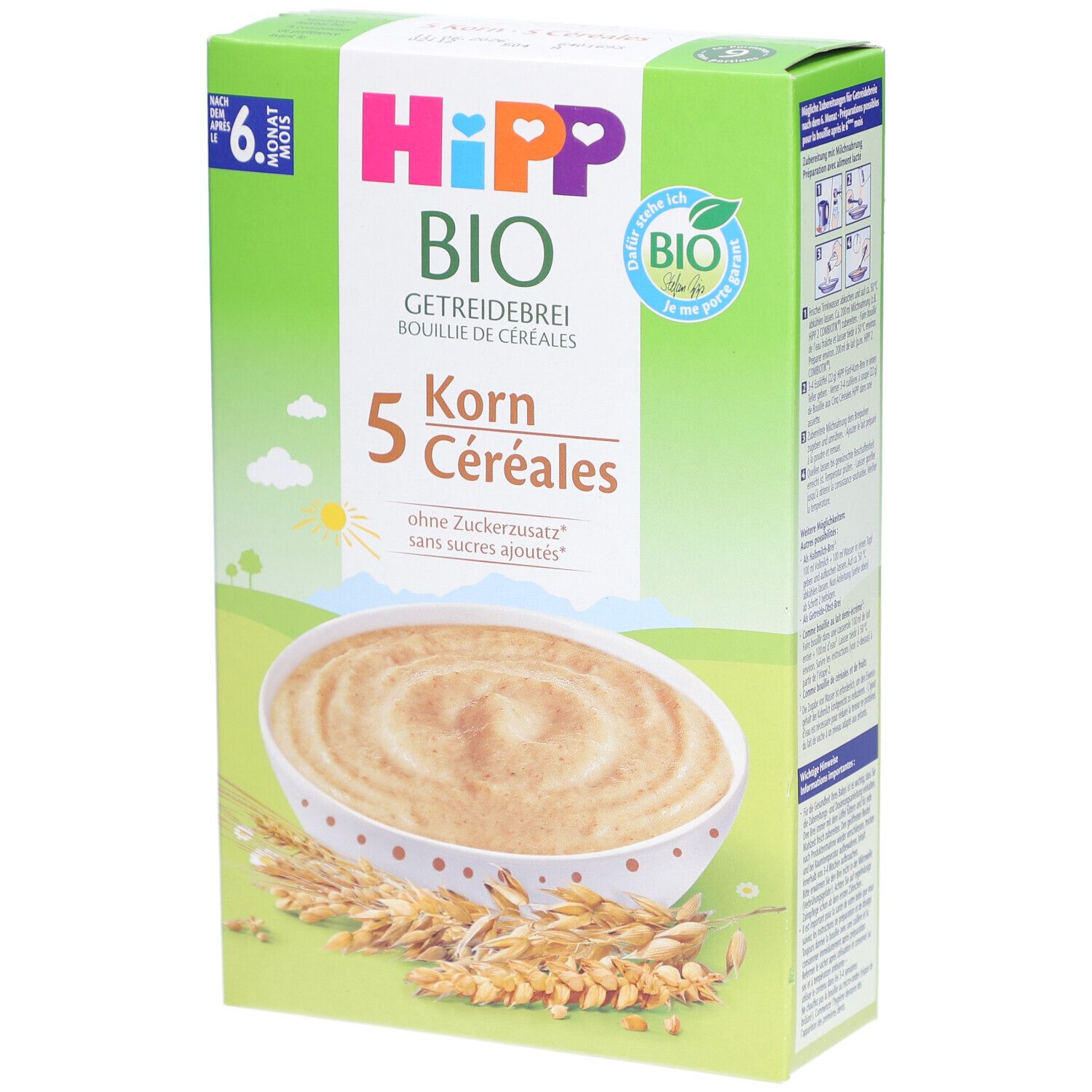 Boîte verte HiPP Bio Getreidebrei. Image d'un bol de bouillie et d'épis de céréales. Texte: 5 Korn, sans sucres ajoutés.