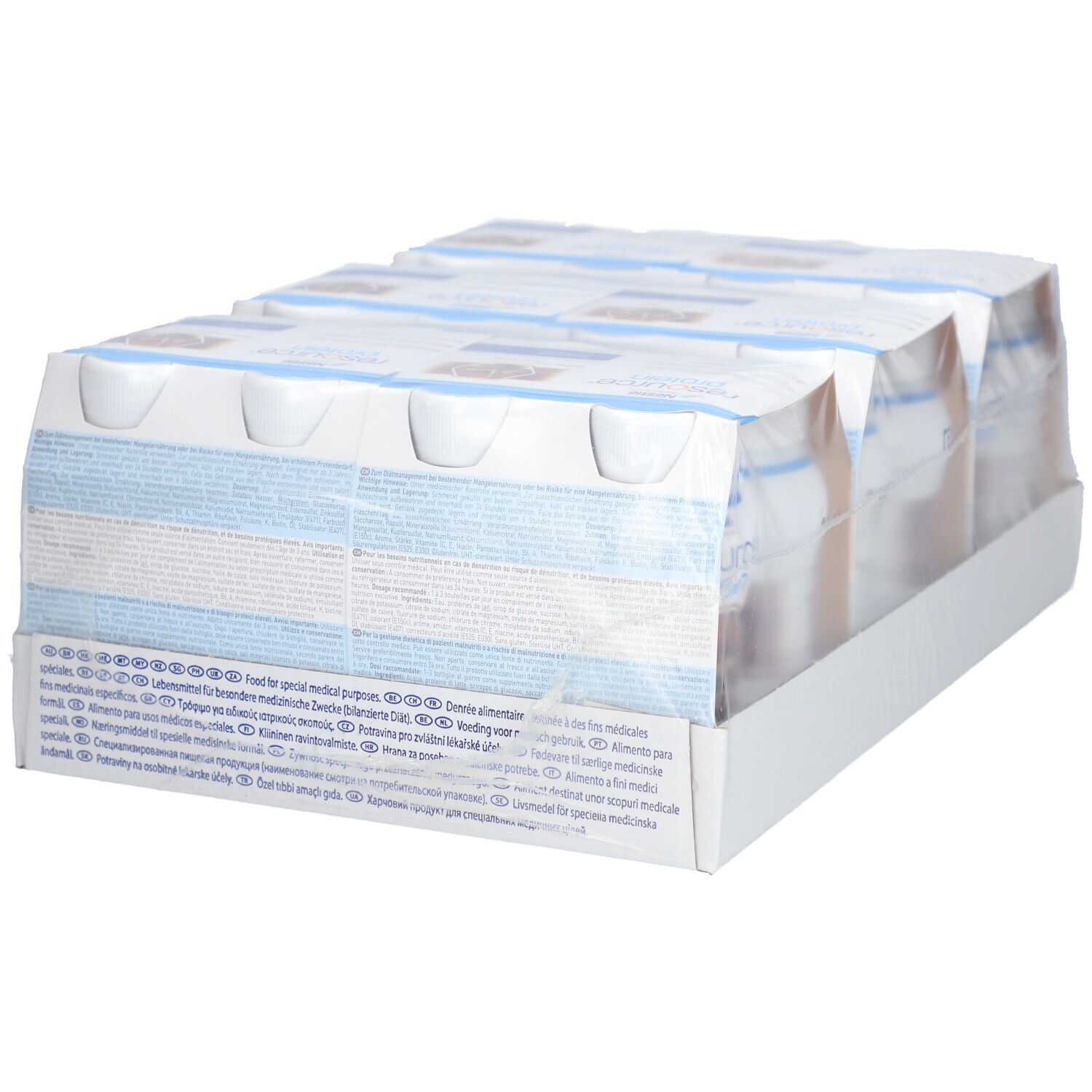 Verpackung mit Protein-Drinks. Rückseite der Verpackung mit Text. Einzelne Flaschen in Folie verpackt. Weiße Verpackung.