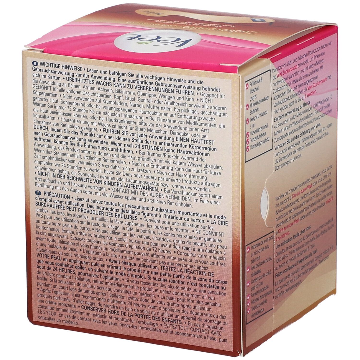 Côté de la boîte de cire Veet. Texte avec avertissements. Couleurs rose et marron.