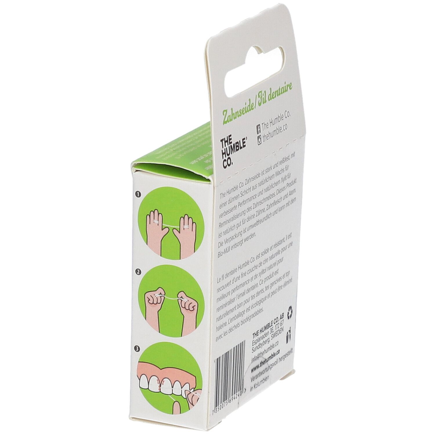 Zahnseide-Verpackung mit Illustrationen zur Anwendung. Text: Zahnseide/Fil dentaire. Logo: The Humble Co. Informationen zum Hersteller.