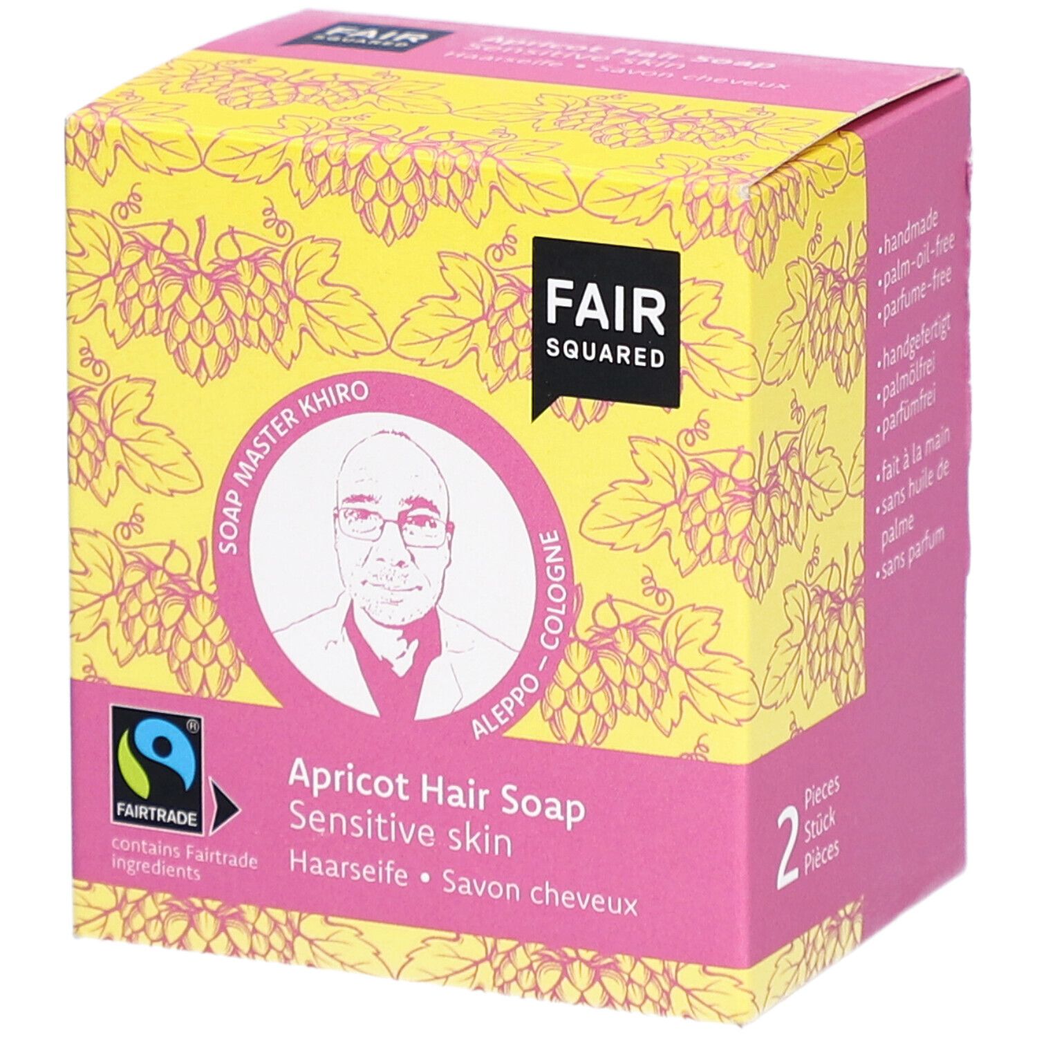 Verpackung der Haarseife Aprikose. FAIR SQUARED Logo, FAIRTRADE-Siegel, Bild von Soap Master Khiro. Aufschrift: Haarseife, Savon cheveux.