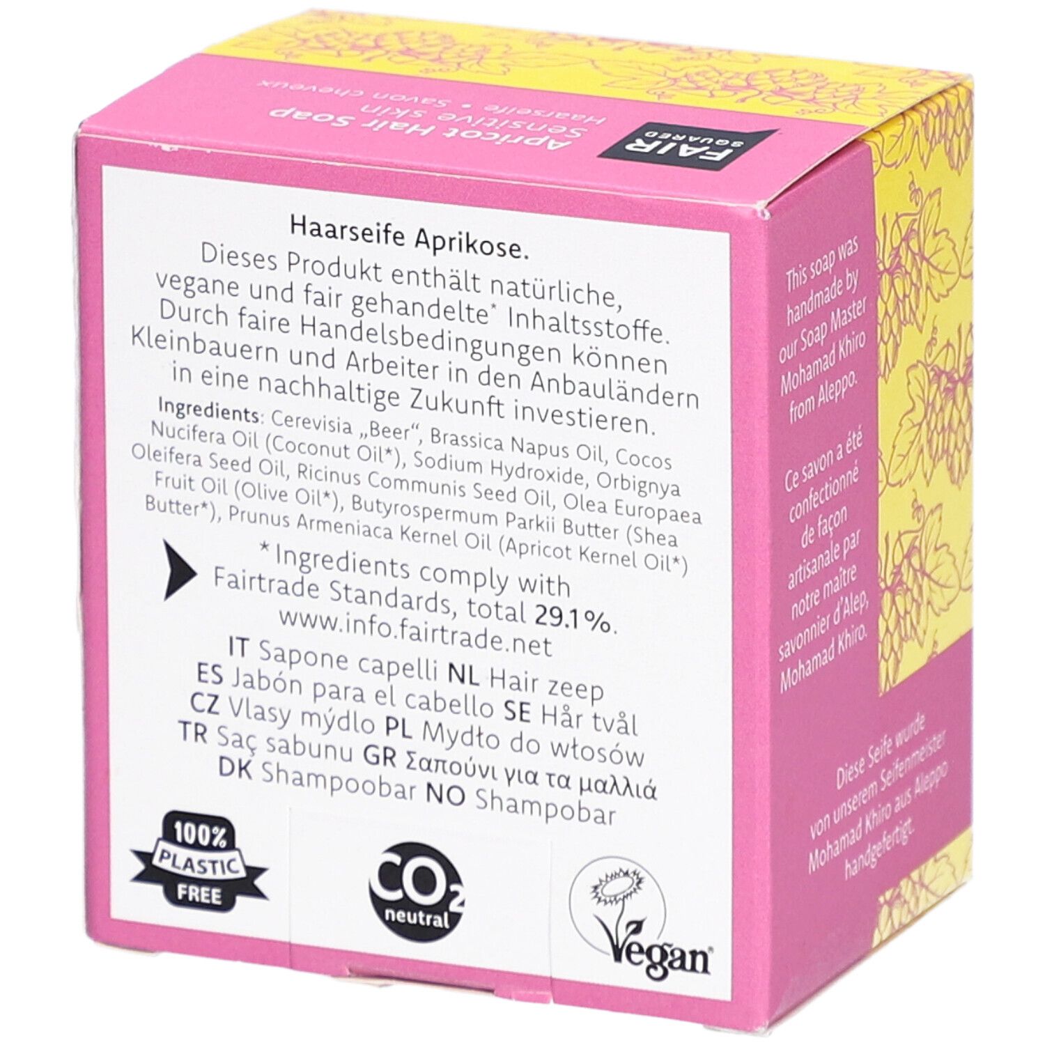 Rückseite der Verpackung. Text: Inhaltsstoffe, vegan, CO2 neutral, 100% plastikfrei. FAIRTRADE-Siegel. Vegan-Siegel. Mehrsprachige Produktinformationen.