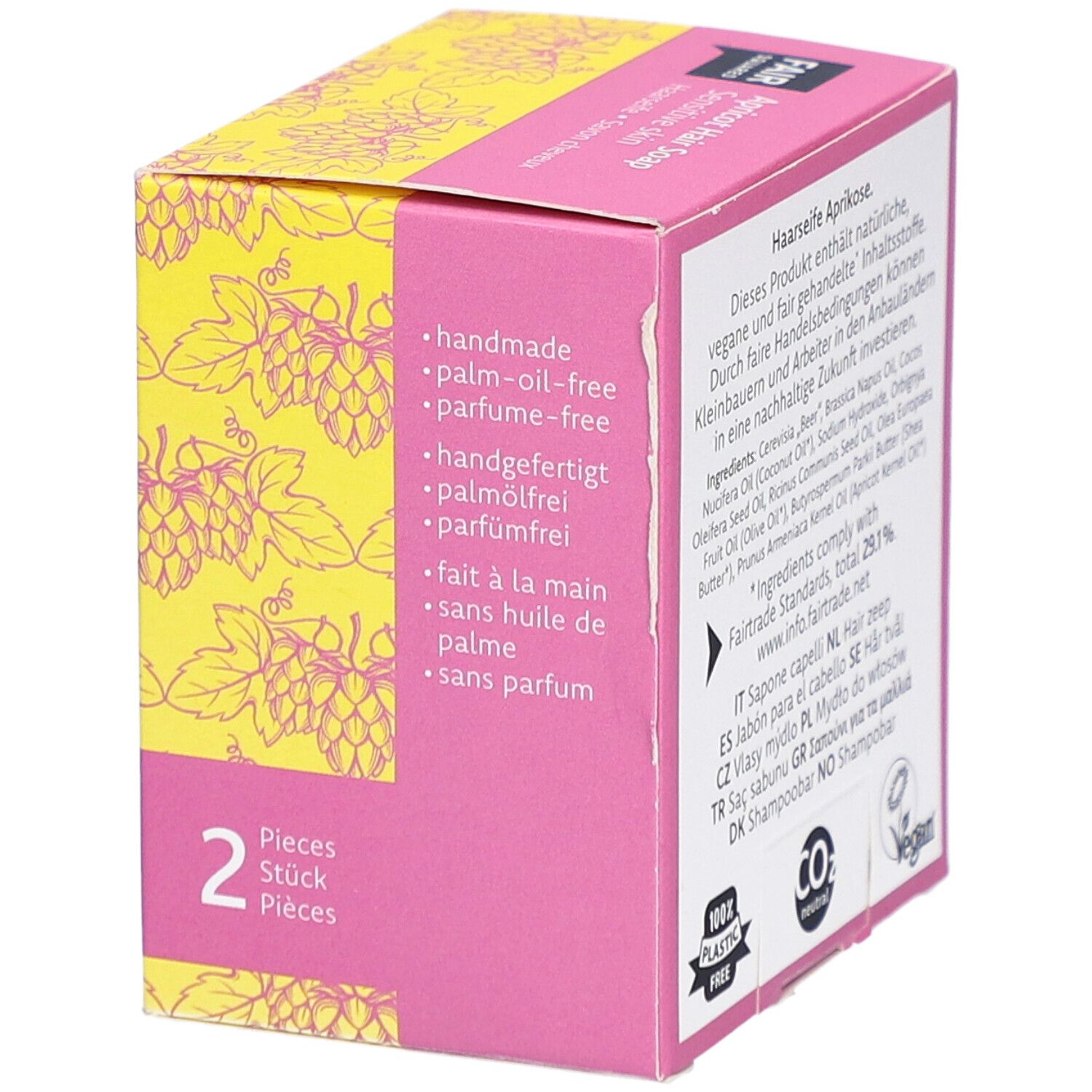 Verpackung der Haarseife. Text: handgemacht, palmölfrei, parfümfrei. 2 Stück. Gelber Hintergrund mit Traubenmuster. Vegan-Siegel.