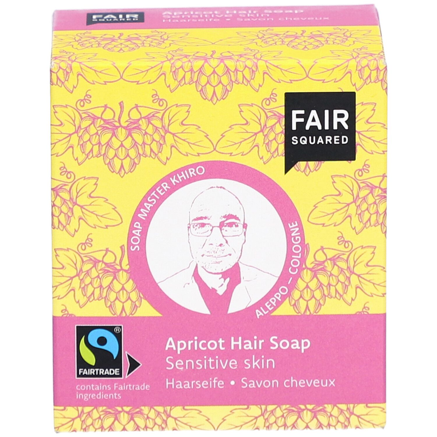 Verpackung der Haarseife Aprikose. FAIR SQUARED Logo, FAIRTRADE-Siegel, Bild von Soap Master Khiro. Aufschrift: Haarseife, Savon cheveux.
