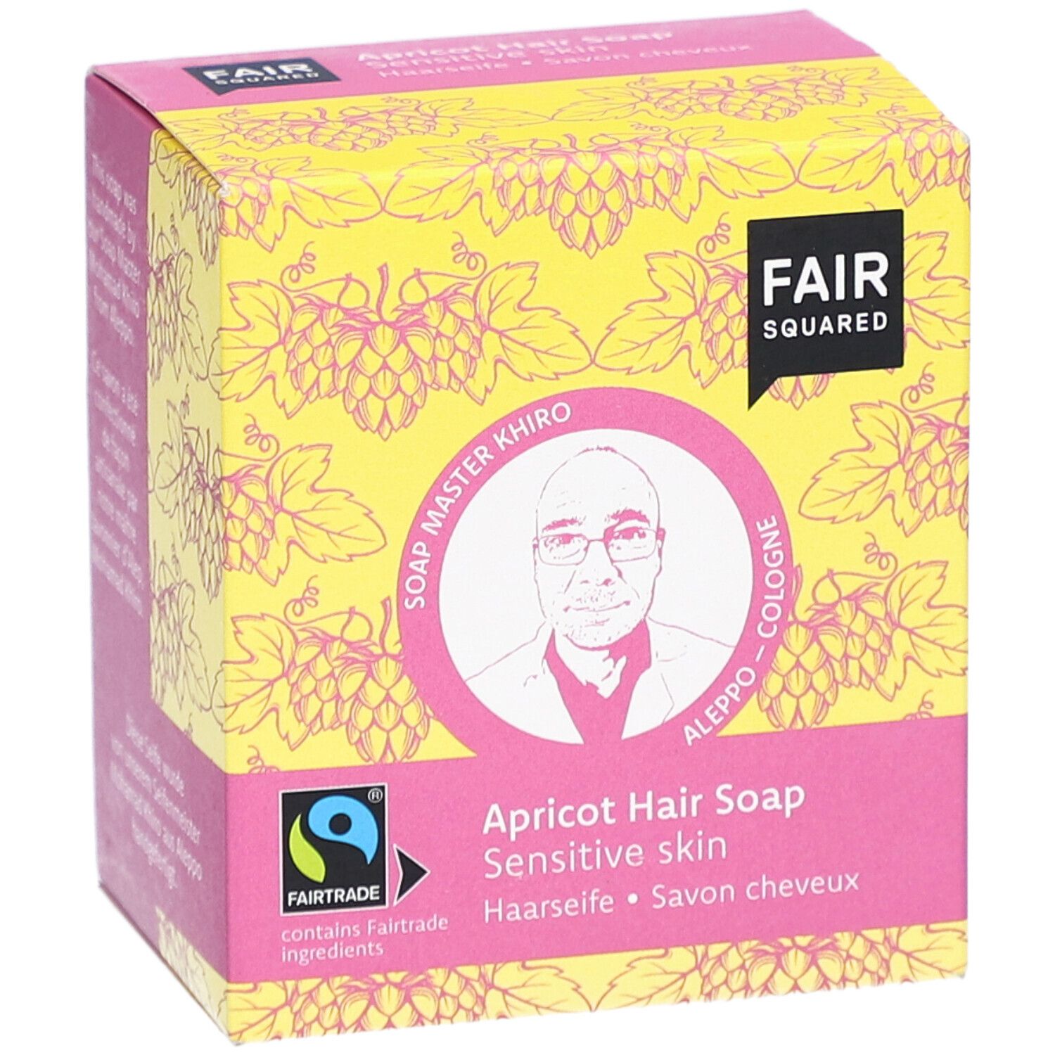 Verpackung der Haarseife Aprikose. FAIR SQUARED Logo, FAIRTRADE-Siegel, Bild von Soap Master Khiro. Aufschrift: Haarseife, Savon cheveux.