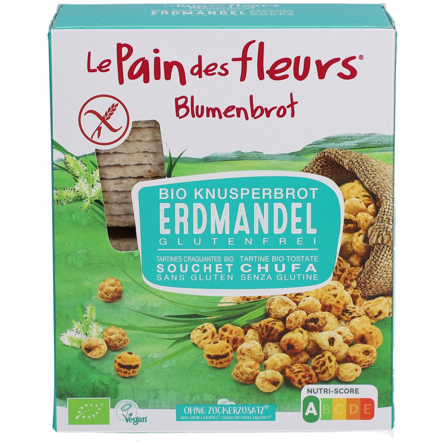Knäckebrot-Verpackung. Aufschrift: Le Pain des Fleurs, Blumenbrot, Bio Knusperbrot Erdmandel glutenfrei. Mit Tigernüssen und Knäckebrot.