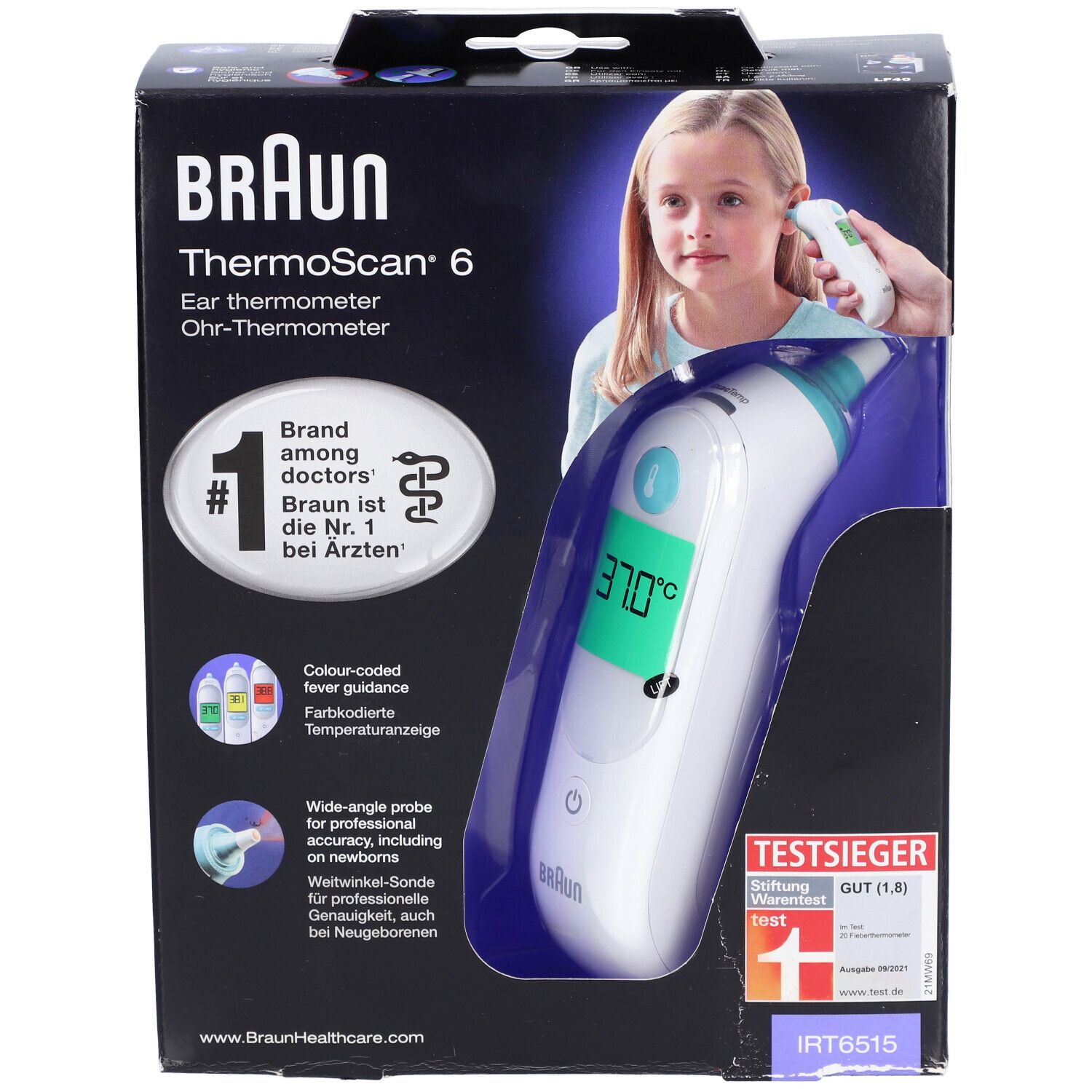 Emballage du thermomètre auriculaire Braun Thermoscan 6. L'appareil est visible dans l'emballage. La température est affichée sur l'écran.