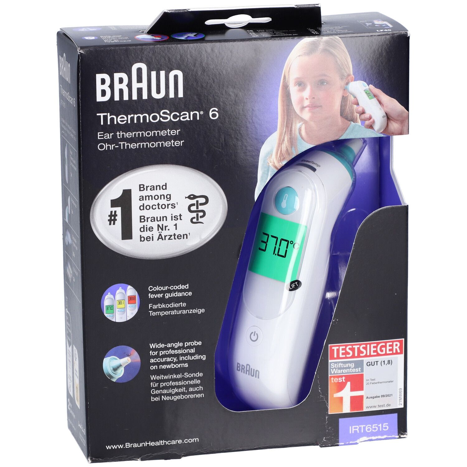 Emballage du thermomètre auriculaire Braun Thermoscan 6. L'appareil est visible dans l'emballage. La température est affichée sur l'écran.