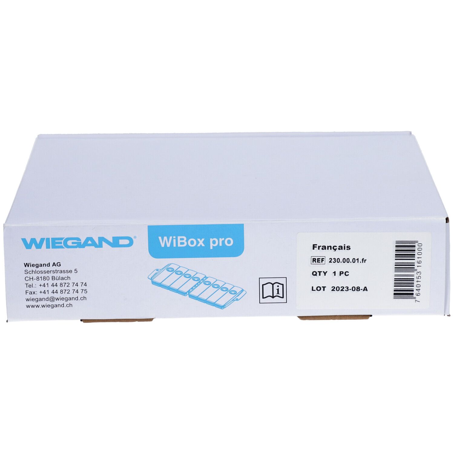 Boîte blanche avec impression WIEGAND, WiBox pro. Étiquette avec informations produit et pictogramme.