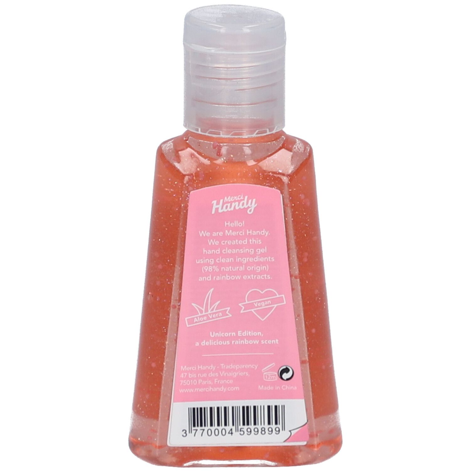 Dos de la bouteille de gel nettoyant pour les mains. Liquide rose. Texte sur une étiquette rose. Logo et texte Merci Handy.