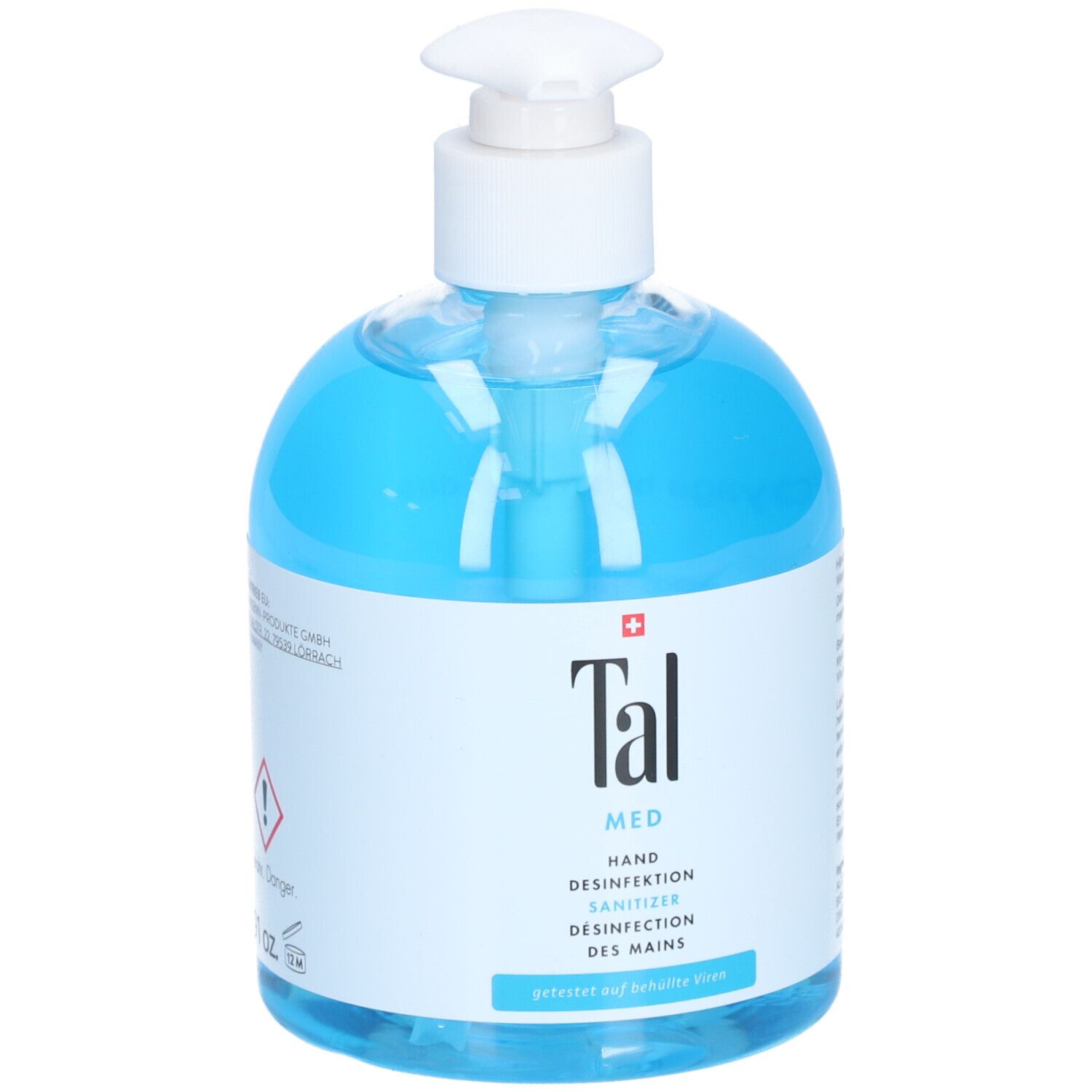 Liquide bleu dans un flacon pompe blanc. Inscription : Tal Med Hand Desinfektion Sanitizer. Croix suisse.
