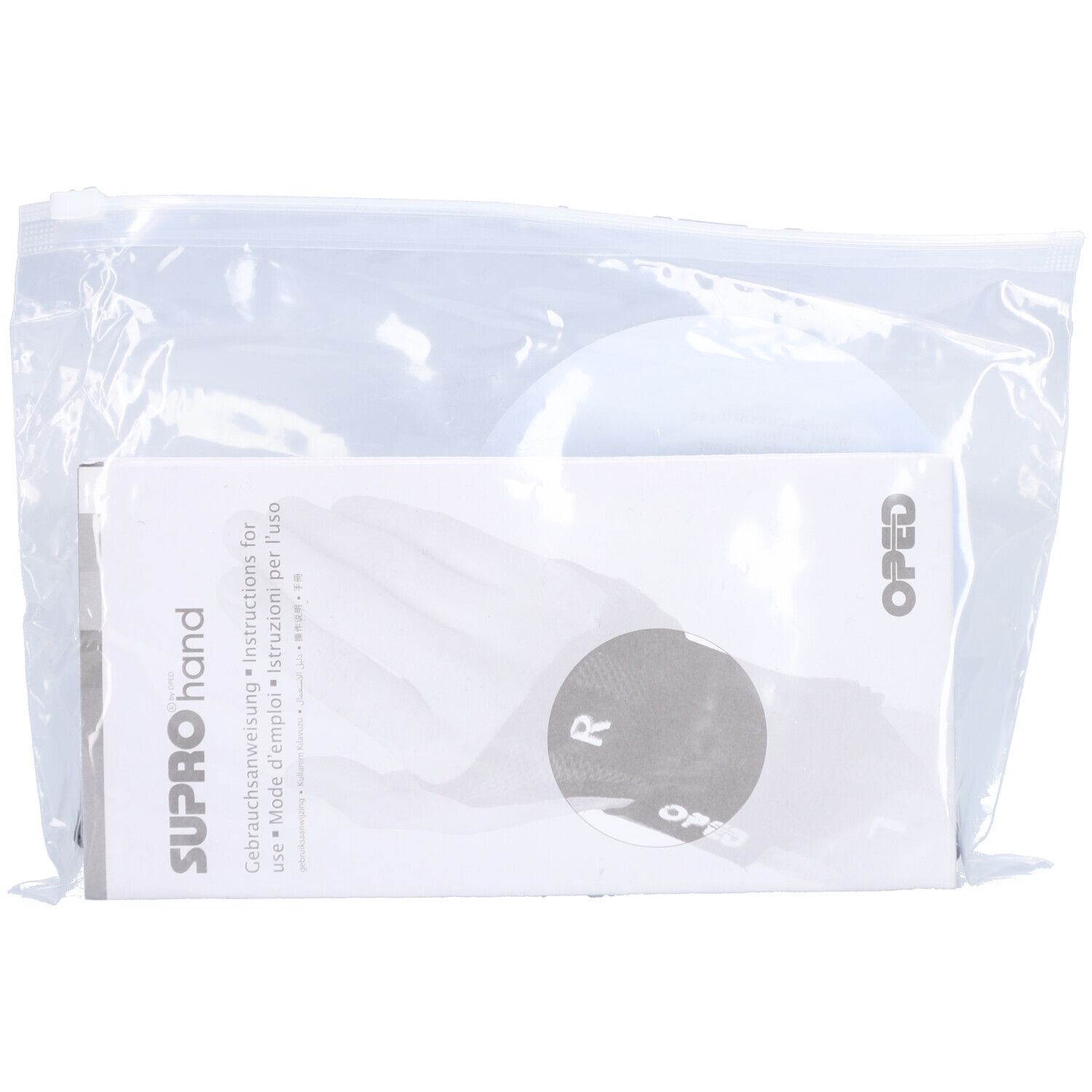 Handgelenkorthese SUPROhand in Plastikverpackung. Gebrauchsanweisung und OPED-Logo sichtbar.