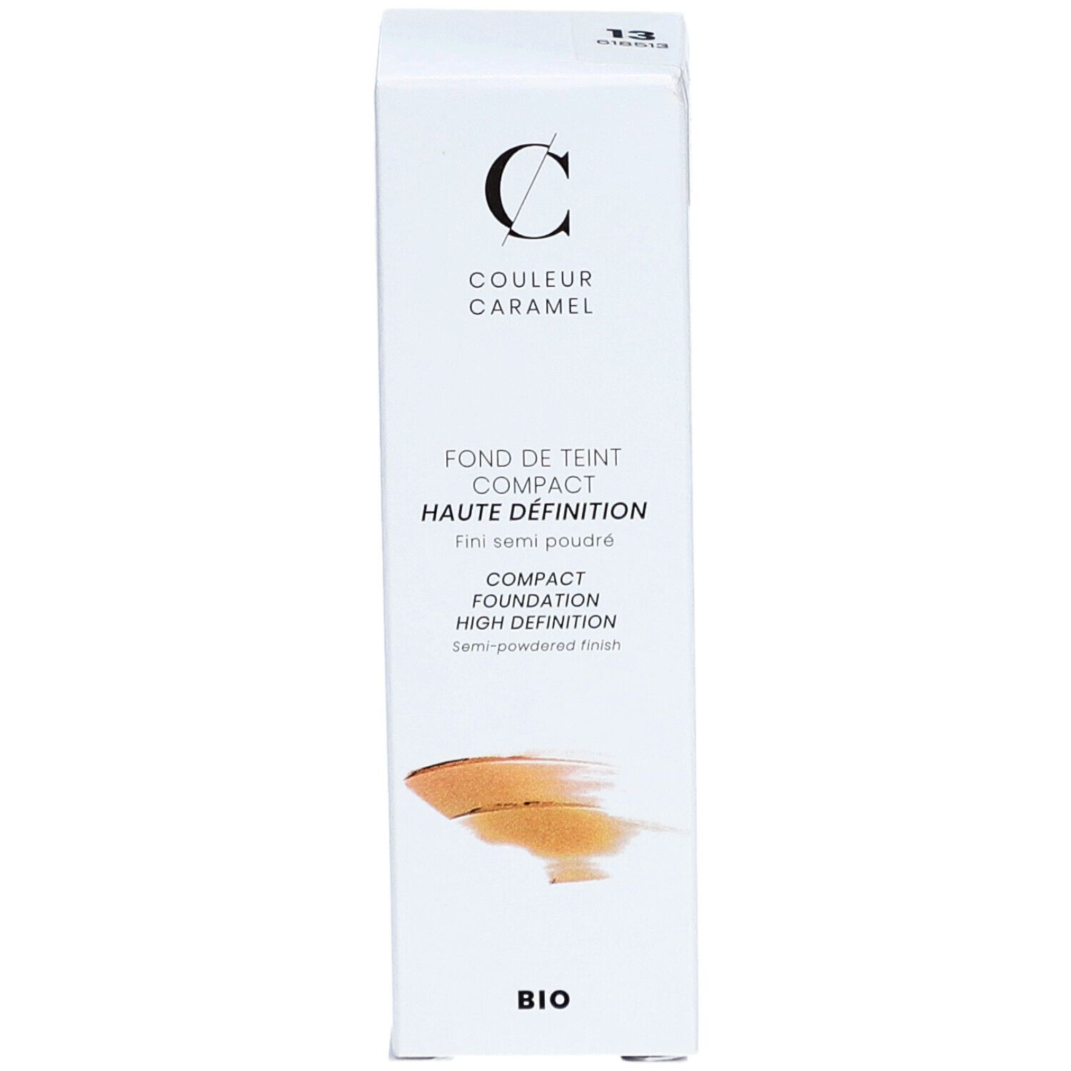 Fond de teint compact COULEUR CARAMEL, emballage blanc. Texte: Fond de Teint Compact Haute Définition. Finition semi-poudrée. Label Bio.