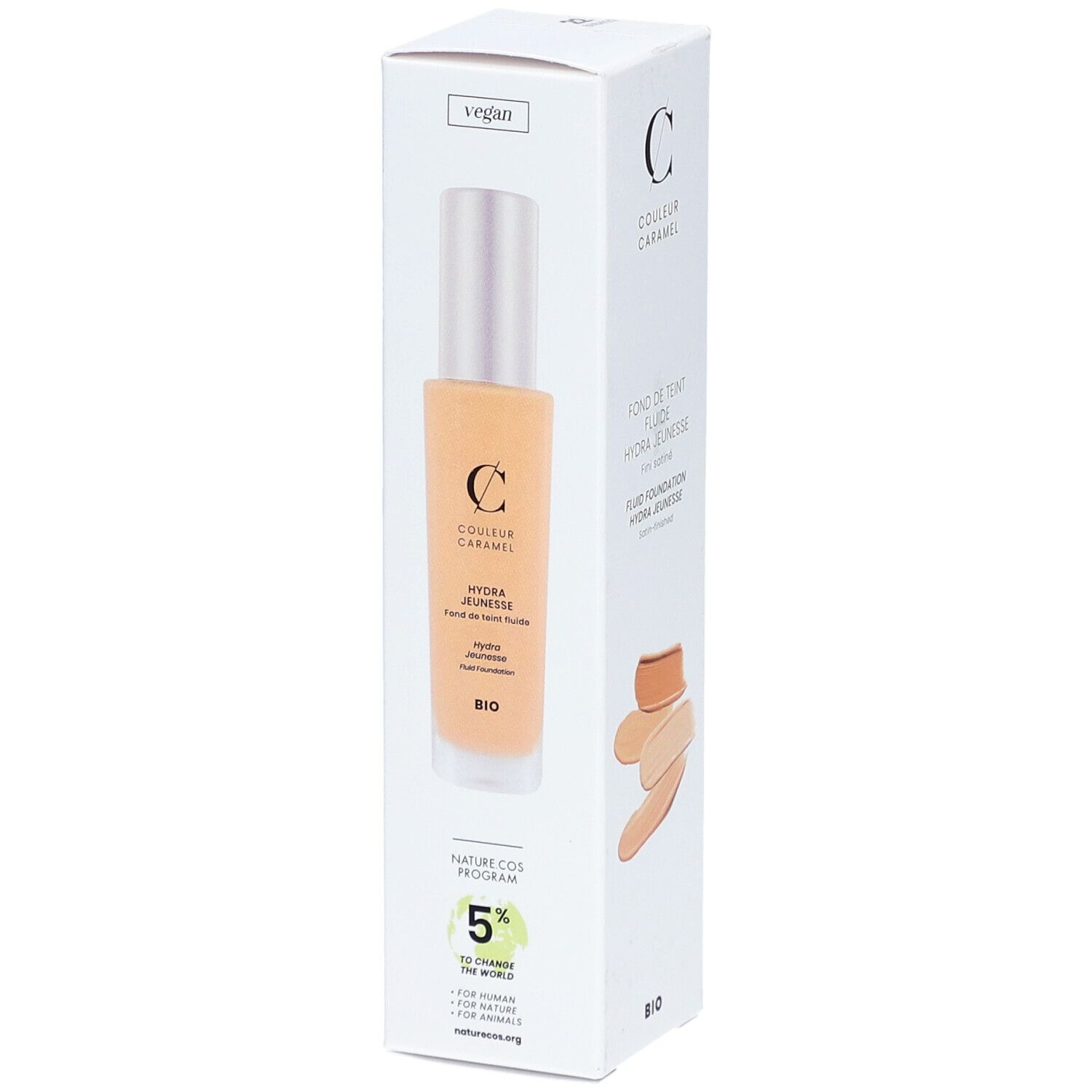 Emballage blanc avec produit et inscription: COULEUR CARAMEL, Fond de Teint Fluide Hydra Jeunesse. Logo vegan.