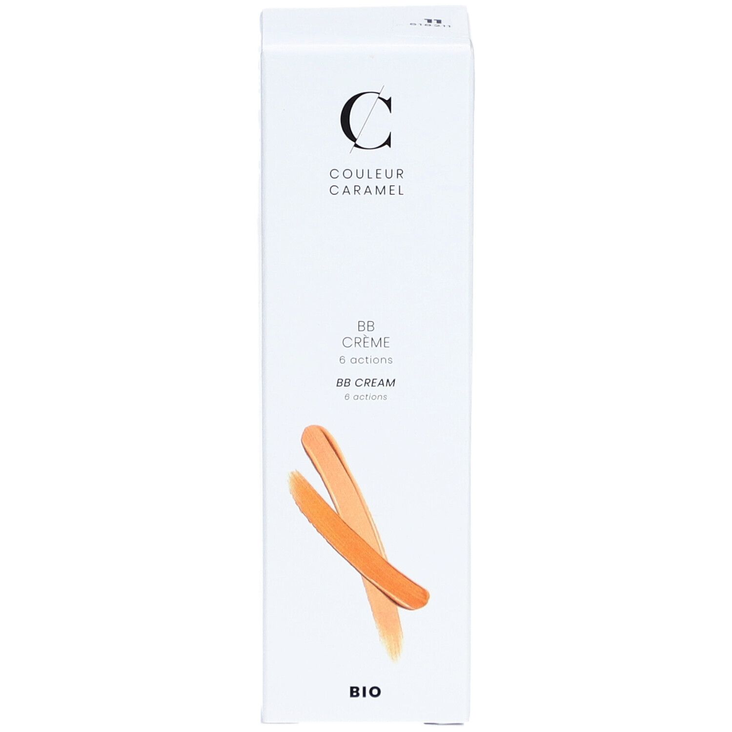 Emballage blanc avec informations produit. Inscription: COULEUR CARAMEL, BB Crème 6 actions, BIO. Deux échantillons de couleur orange.