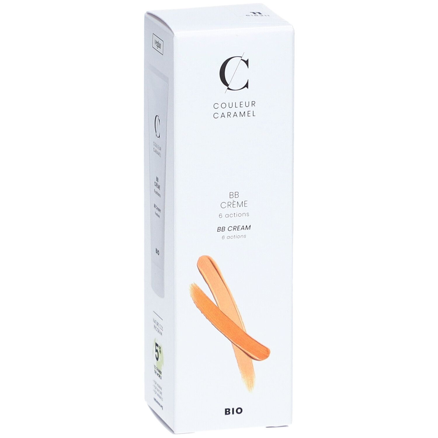 Emballage blanc avec informations produit. Inscription: COULEUR CARAMEL, BB Crème 6 actions, BIO. Deux échantillons de couleur orange.