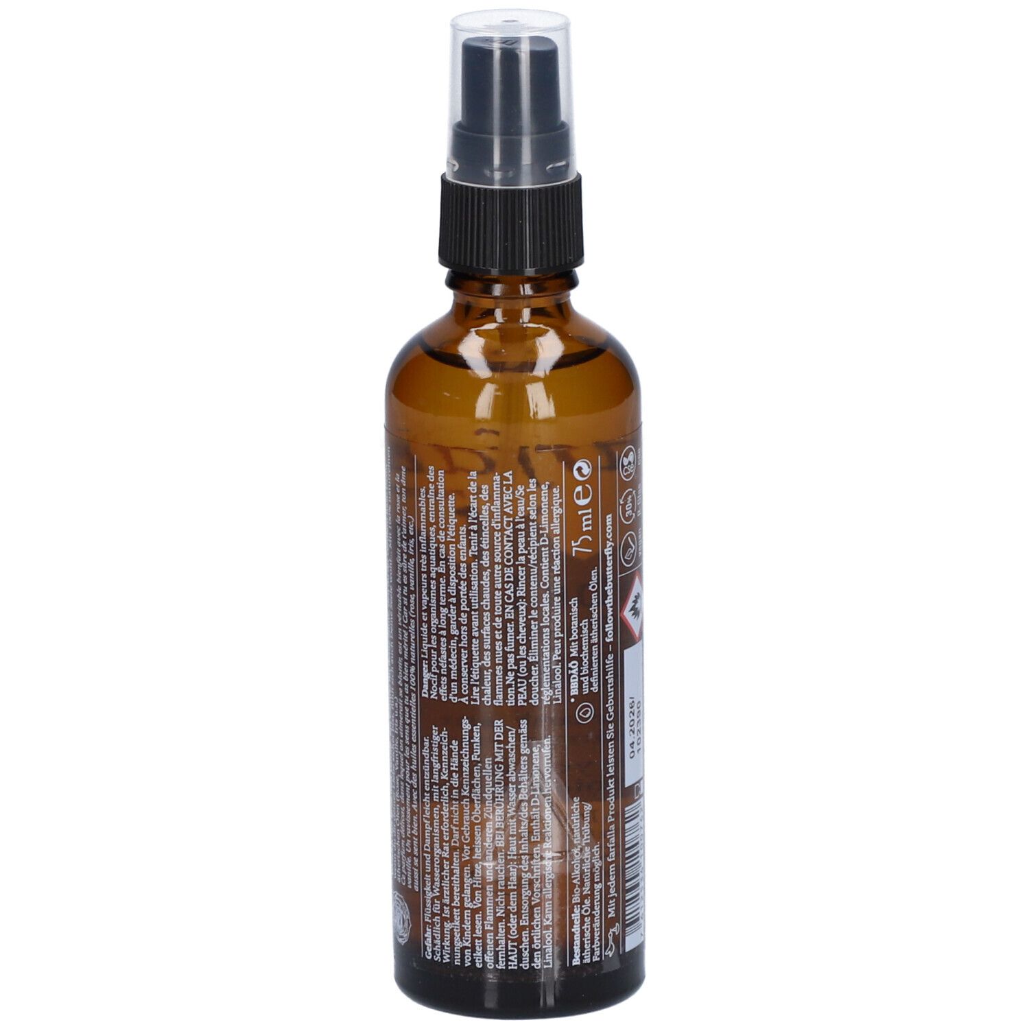 Flacon en verre brun avec vaporisateur. Dos avec texte. Inscription: 75 ml.